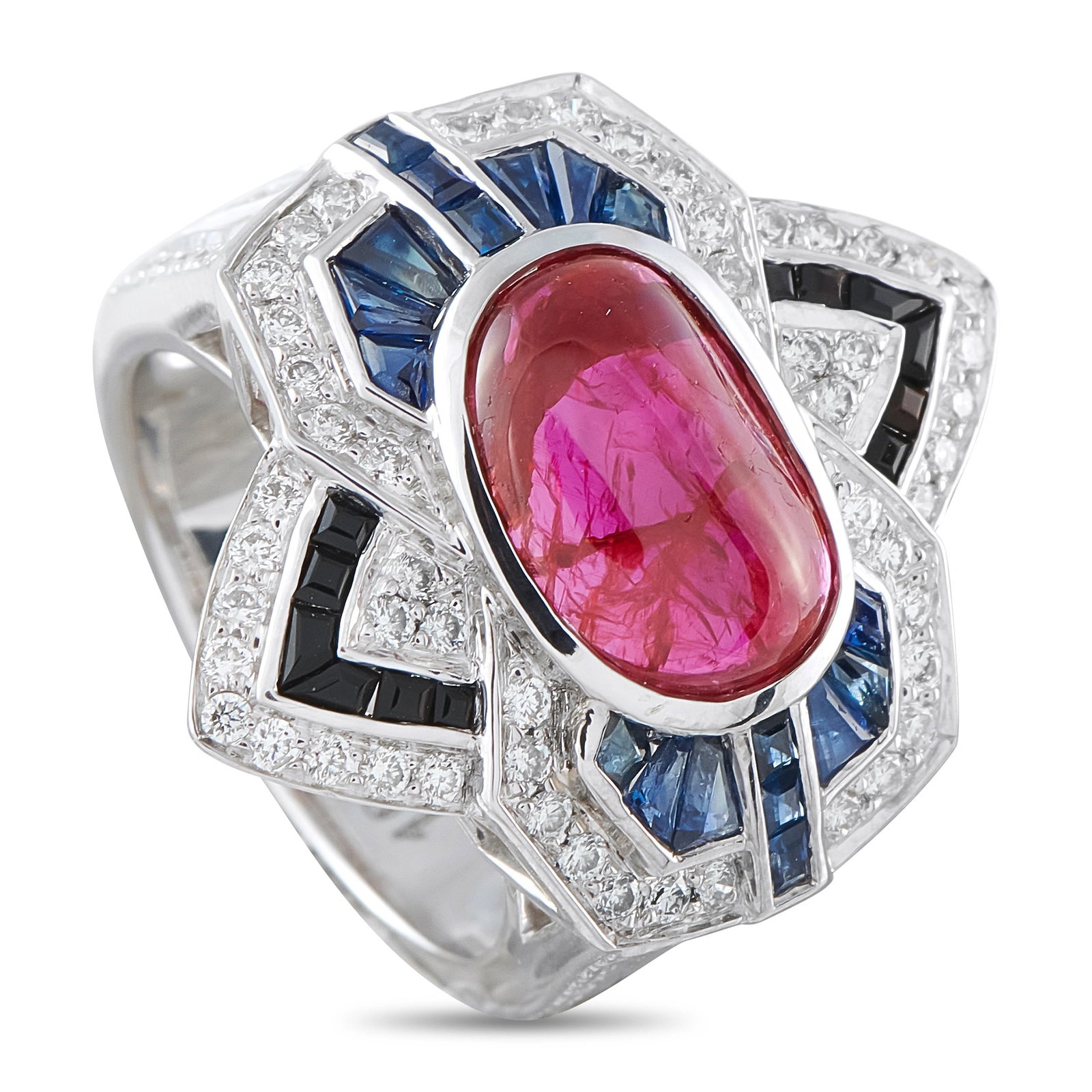 18K White Gold 0.88ct Diamond, Ruby and Sapphire Geometric Cocktail Ring: A bold Art Deco-inspired cocktail ring in 18-karat white gold, featuring a 1.50 carat large oval cabochon ruby at center encased in a geometric frame of calibré-cut blue sapphires and an outer border