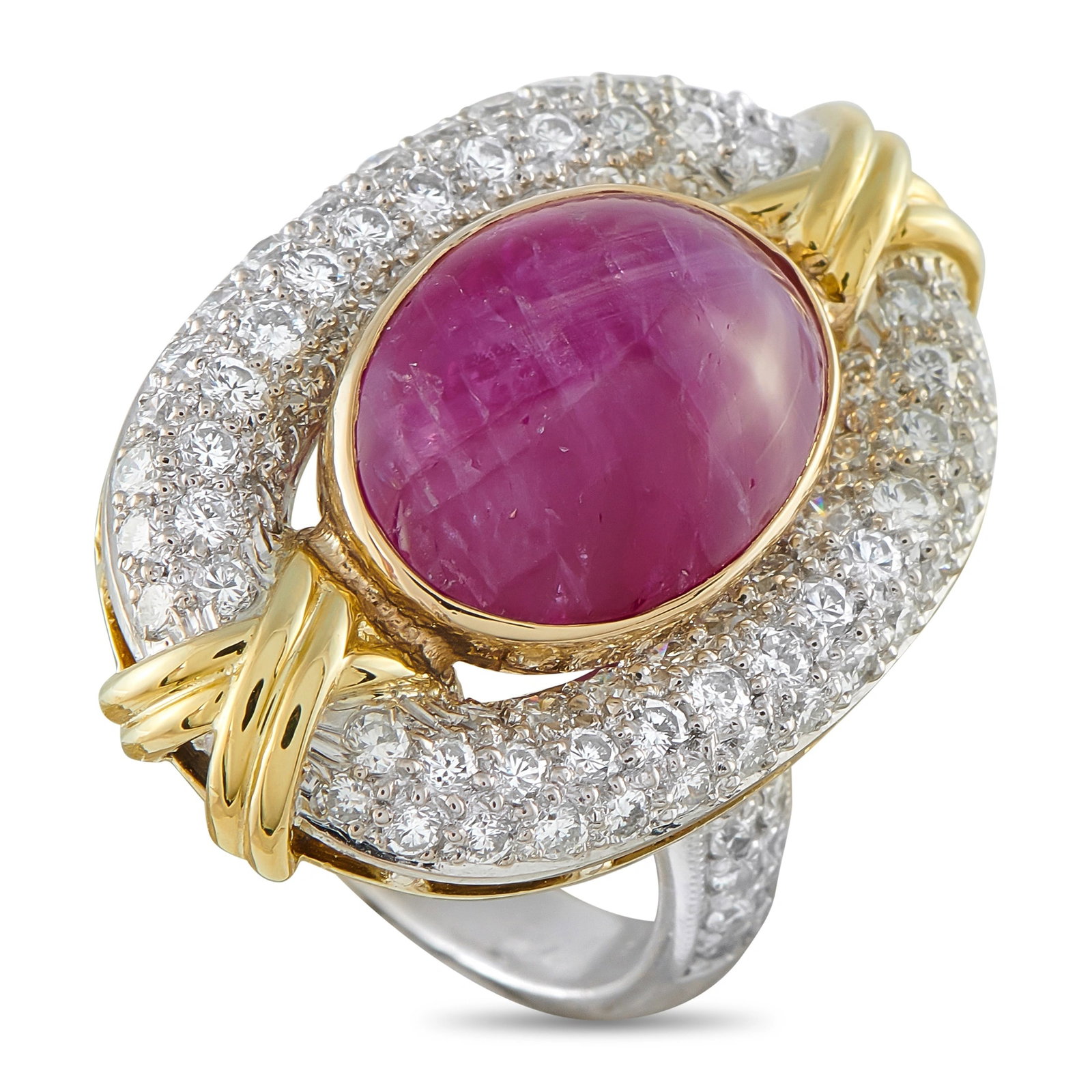 Platinum and 18K Yellow Gold 1.50ct Diamond and Star Ruby Ring: This ring will serve as an opulent addition to any jewelry collection. Lustrous 18K Yellow Gold accents beautifully complement the breathtaking 11.81 carat Star Ruby cabochon center stone. Inset Diamo
