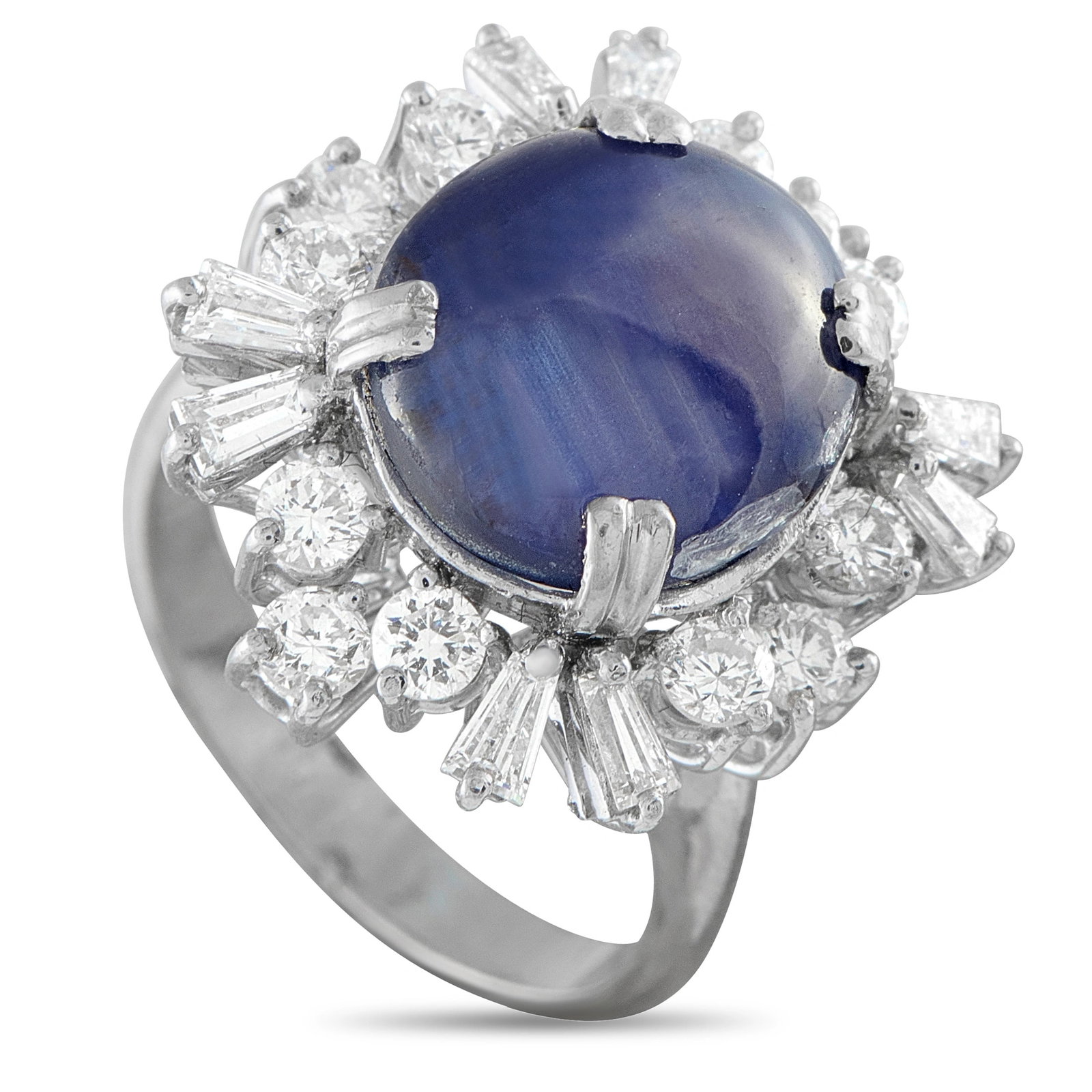 18K White Gold 1.20ct Diamond and Sapphire Cabochon Halo Ring: A striking cocktail ring in 18K white gold, centering a large oval sapphire cabochon totaling 7.50 carats, encircled by a sunburst halo of alternating round brilliant and baguette diamonds totaling