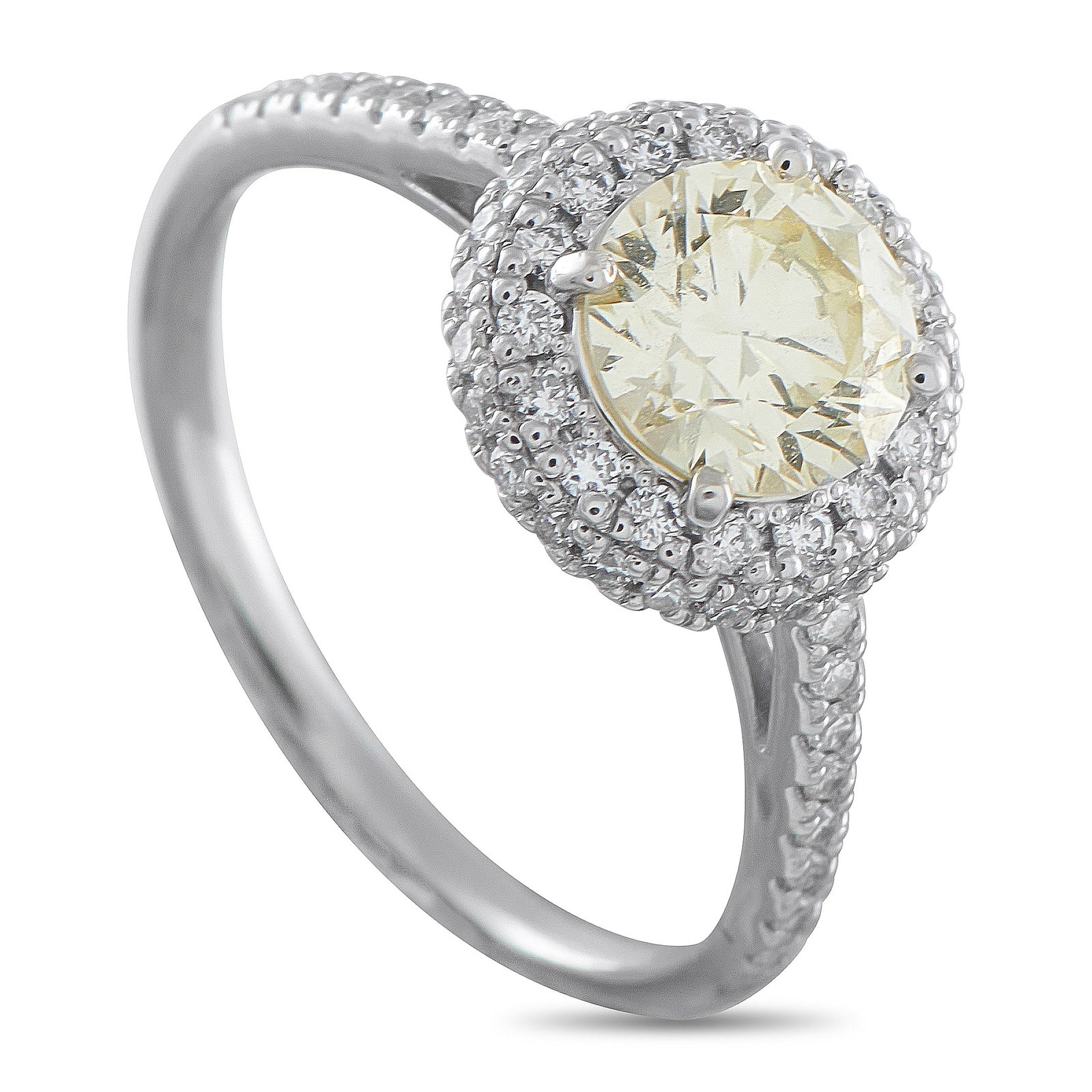 Platinum 1.35ct Diamond Double Halo Ring: In this diamond ring, details are revealed through careful layering and scale. A 1.01-carat round diamond rests at the center, lifted to a 7mm height and surrounded by a cascading double halo of small