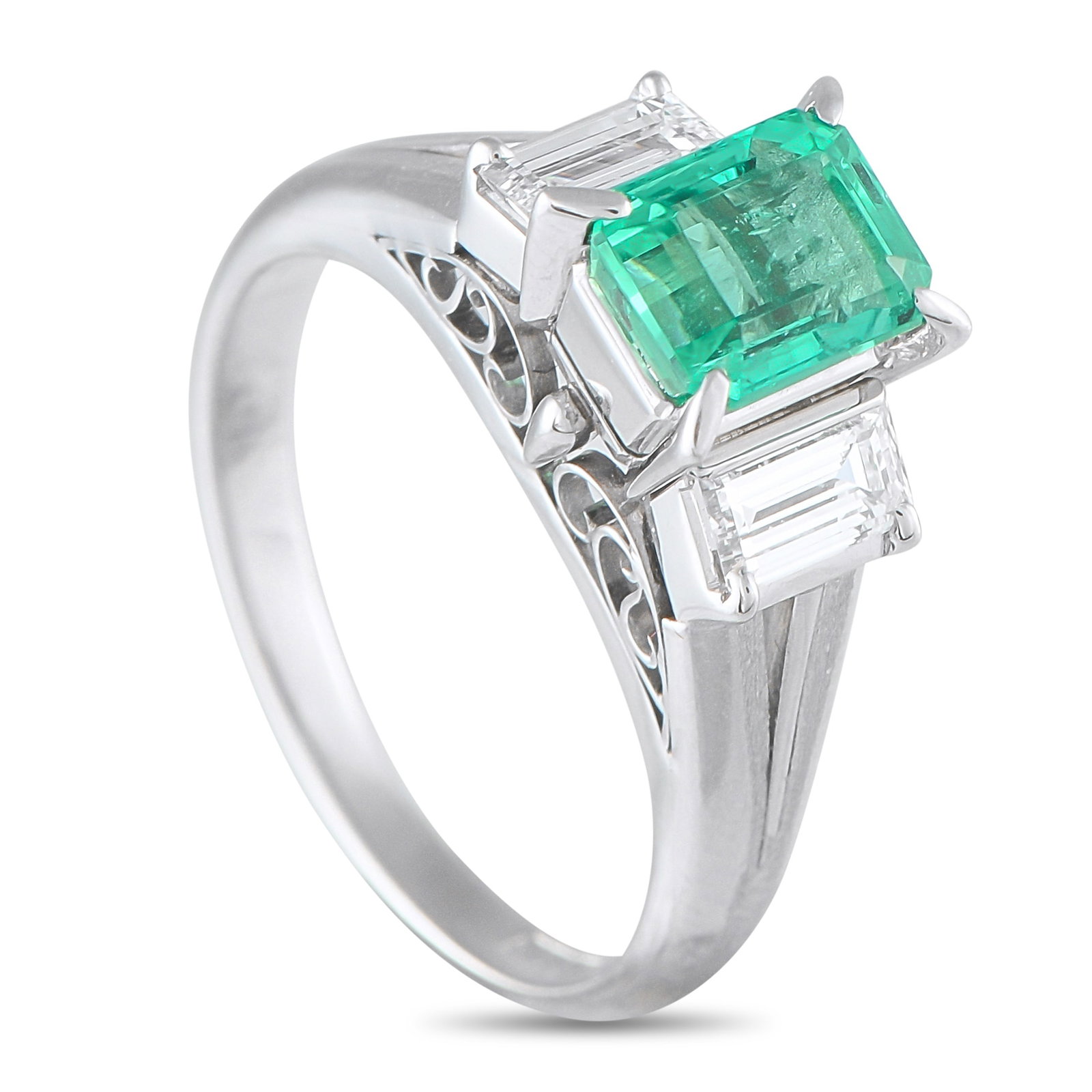 Platinum 0.51ct Diamond and Emerald Ring: This luxury ring is filled with breathtaking details. A detailed Platinum setting beautifully showcases the classic three-stone design, which includes a 1.06 carat Emerald center stone and Diamond acc