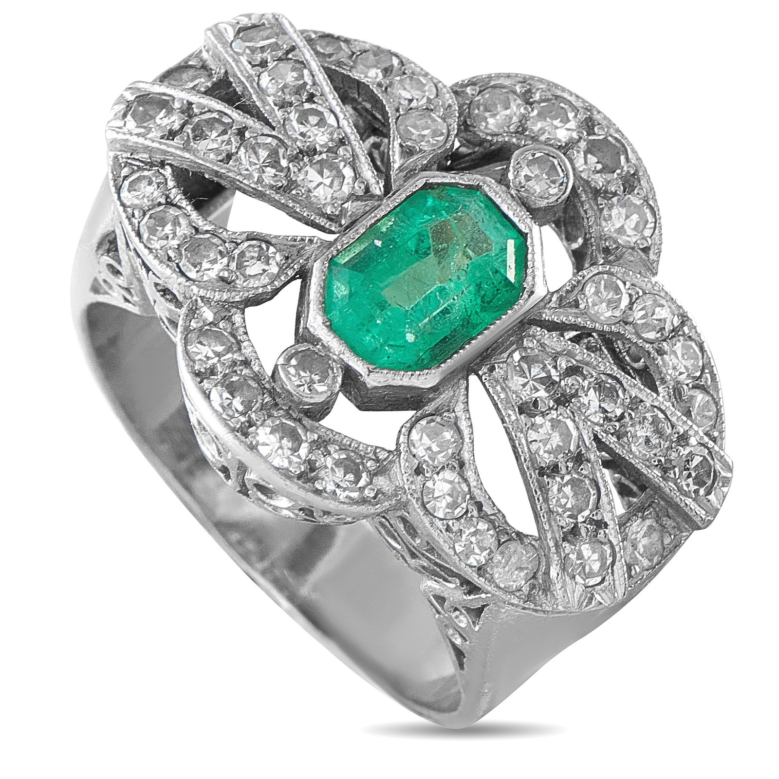 Vintage 18K White Gold 0.84ct Diamond and Emerald Ring: This vintage ring exudes old fashioned elegance. The delicate 18K White Gold setting is elevated by inset Diamonds totaling 0.84 carats. A 0.70 carat Emerald center stone provides the perfect finishin