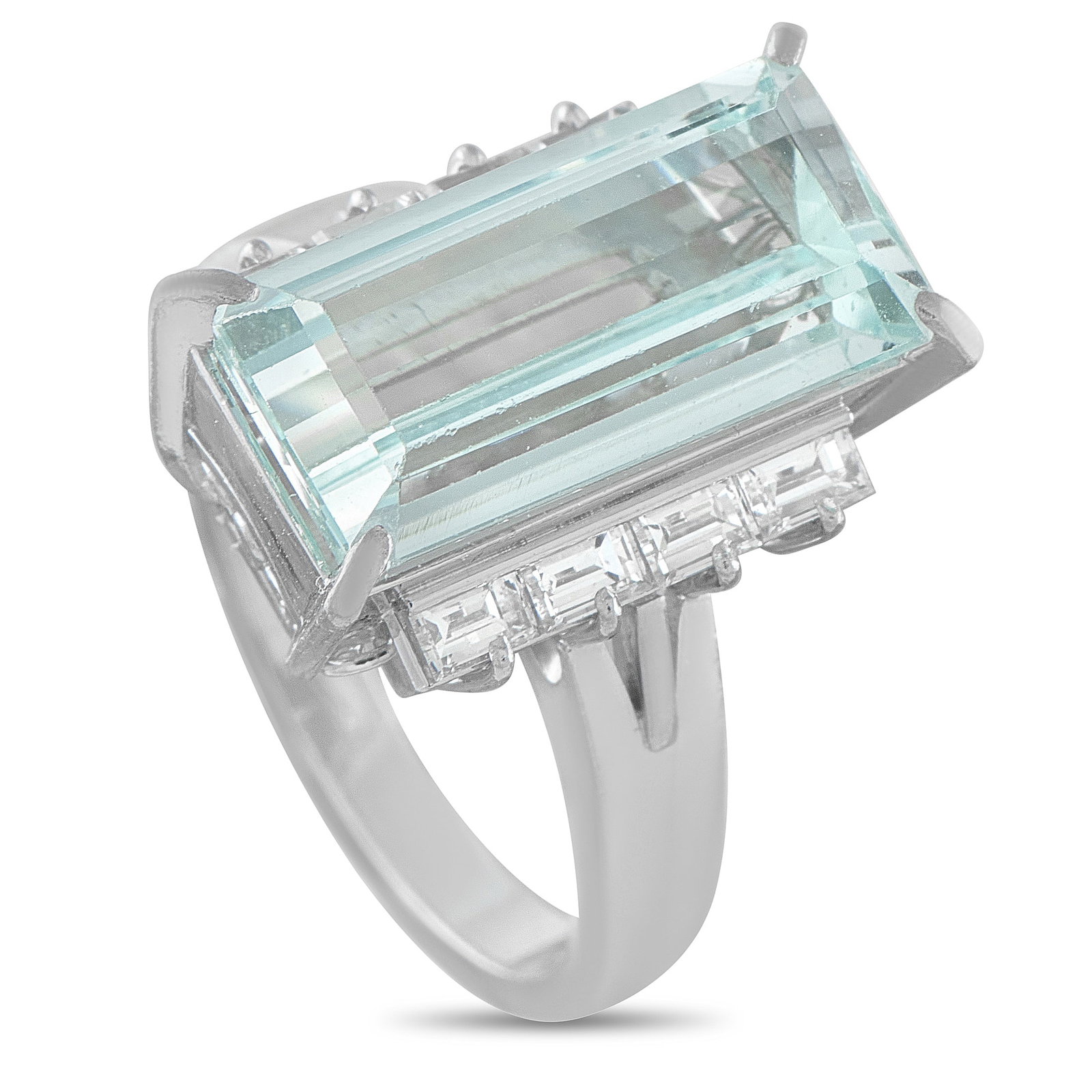 Platinum 0.69ct Diamond and Aquamarine Ring: If you love blue gemstones but want to skip busy, old-fashioned sparkle, a vertical baguette aquamarine is your answer. The step-cut facets of the 6.12 ct aquamarine in this ring cast calm, mirror-lik