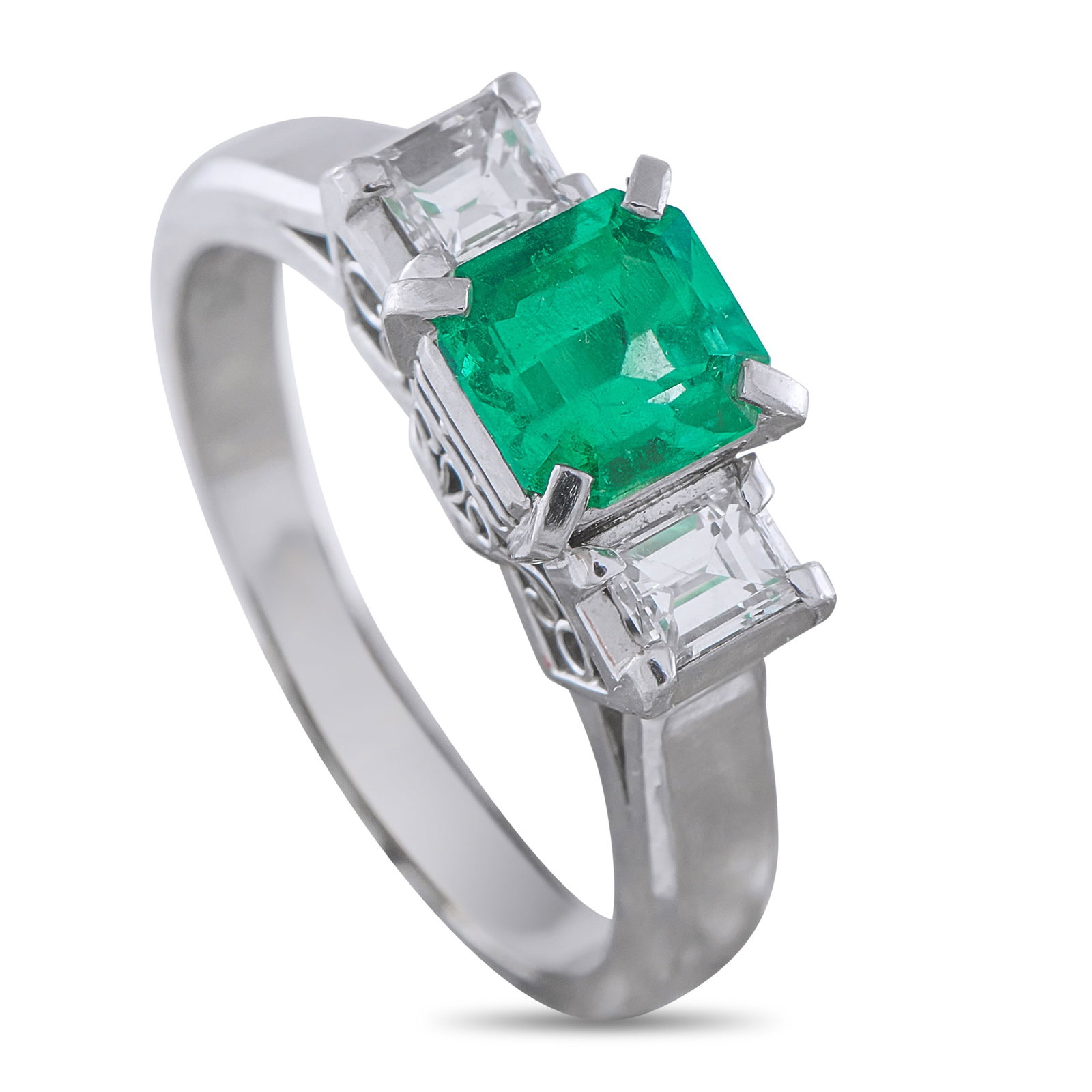 Platinum 0.36ct Diamond and Emerald Ring: A classic three-stone design makes this luxury ring simple timeless. The ornate Platinum setting adds extra vintage elegance to this stylish piece. At the center, a 0.86 carat Emerald is flanked by