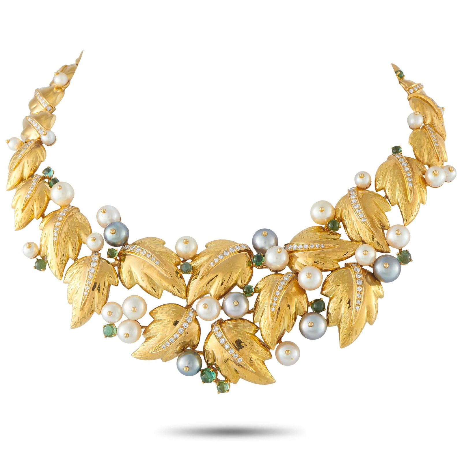 Chaumet 18K Yellow Gold 2.20ct Diamond, Pearl, and Tourmaline Foliage Bib Necklace: This Chaumet necklace is crafted from 18K yellow gold in the house’s iconic Foliage design, with textured leaf motifs set with pavé diamonds totaling approximately 2.20 carats. Clusters of white an