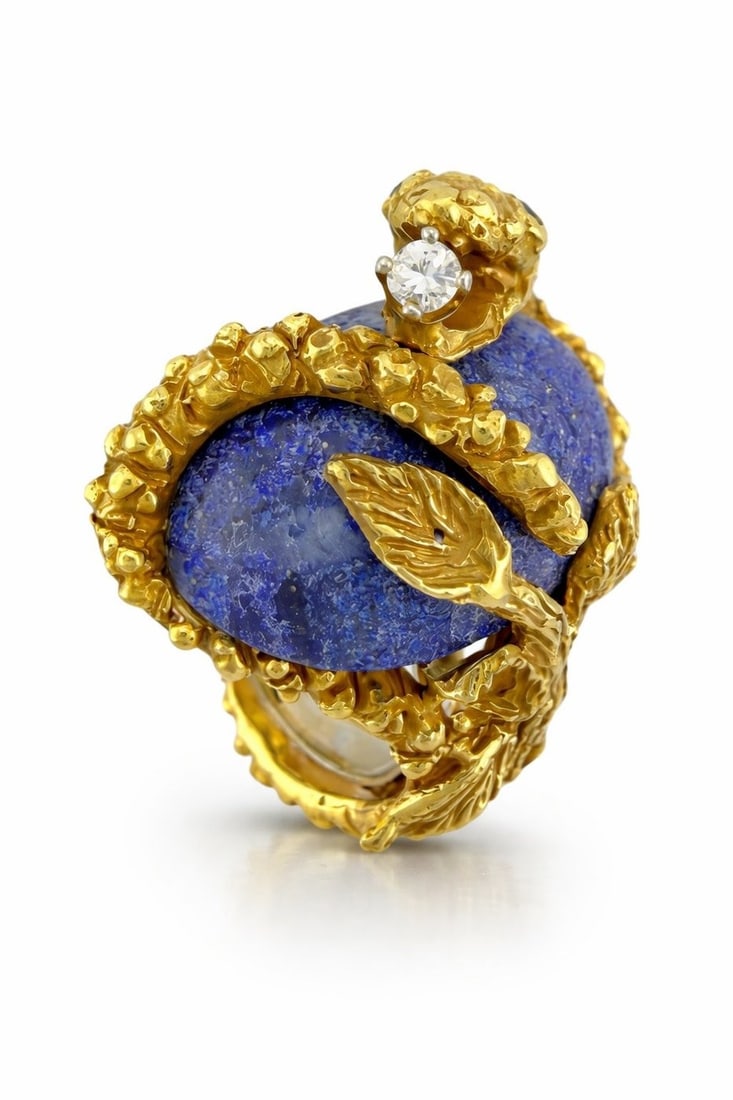 18K Yellow Gold Lapis 0.08ct Diamond and 40ct Sapphire Snake Ring: 18K Yellow Gold Lapis 0.08ct Diamond and 40ct Sapphire Snake Ring A bold and sculptural statement ring crafted in rich 18 karat yellow gold. This striking design features a large oval cut lapis at the