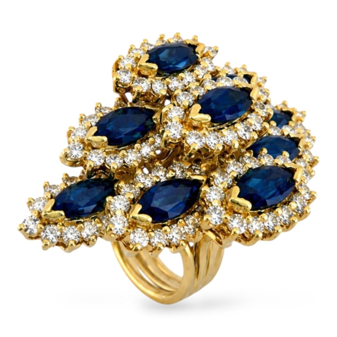18K Yellow Gold 3.50ct Sapphire and 2.50ct Diamond Cocktail Ring: 18K Yellow Gold 3.50ct Sapphire and 2.50ct Diamond Cocktail Ring An opulent and dimensional cocktail ring showcasing nine marquise cut blue sapphires arranged in a dramatic layered composition. Each