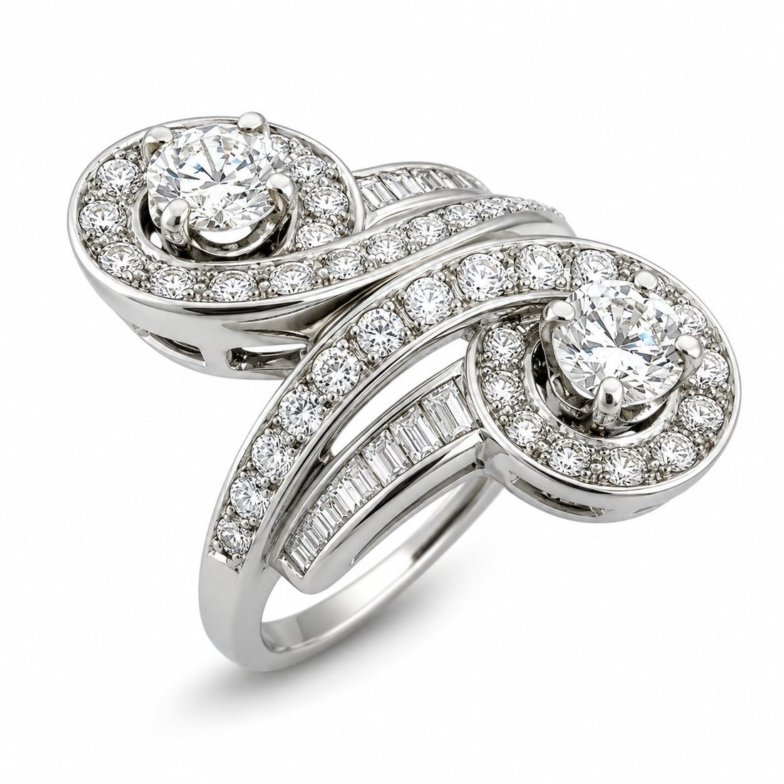 18K White Gold 2.45ct Diamond Ring: 18K White Gold 2.45ct Diamond Ring This elegant ring is crafted in 18 karat white gold and features a flowing circular design set with diamonds throughout. Larger diamonds are positioned across from o