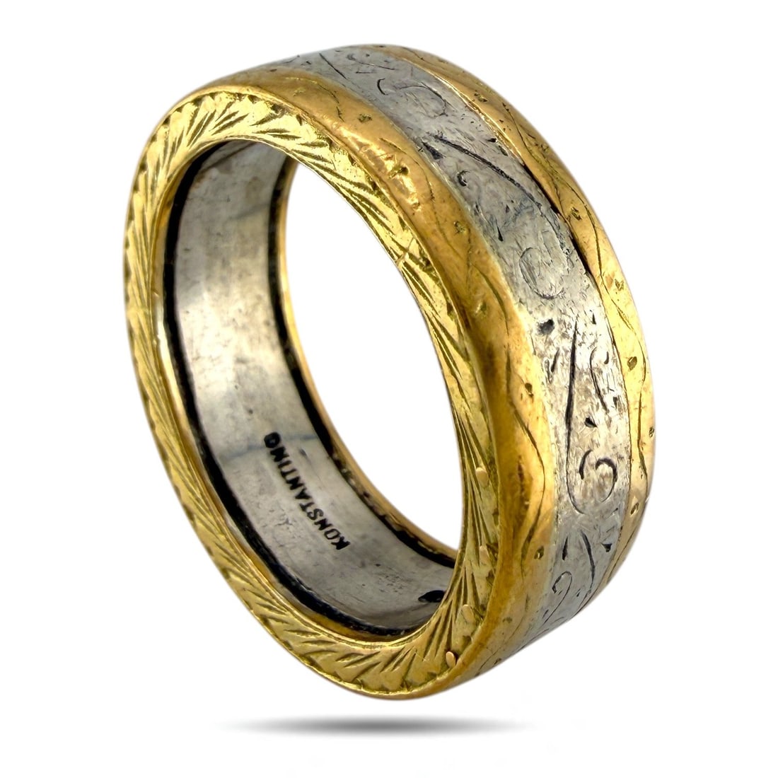 Konstantino 18K Yellow Gold and Platinum Band: Konstantino 18K Yellow Gold and Platinum Band Ring A striking Konstantino band ring combining 950 platinum and 18K yellow gold for a luxurious two-tone effect. The band features a central yellow gold