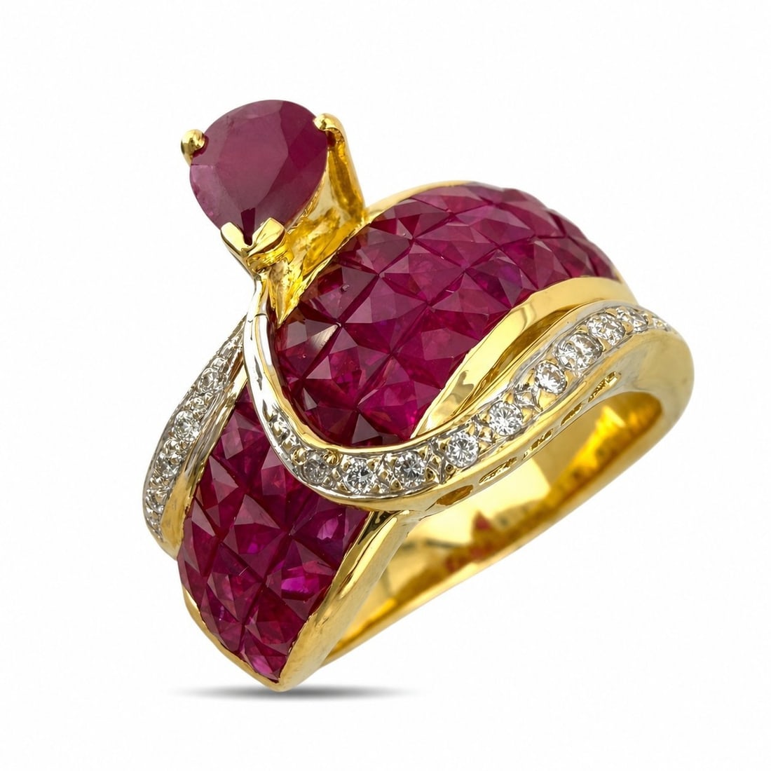 14K Yellow Gold 3.2ct Ruby and 0.1ct Diamond Ring: 14K Yellow Gold 0.1ct Diamond and 3.2ct Ruby Ring A striking and richly colored ring crafted in 14 karat yellow Gold, designed with a vivid ruby center accented by square cut rubies and sparkling diam