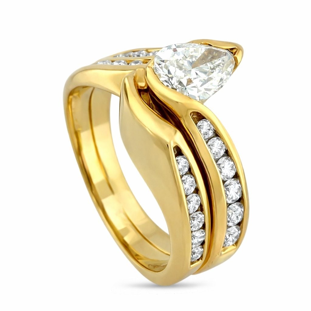 Michael’s 14K Yellow Gold 1.06ct Diamond Ring: Michael's 14K Yellow Gold 1.06ct Diamond Ring A refined and elegant design crafted in rich 14K yellow gold, this Michael's ring features a graceful teardrop cut center diamond elevated above a