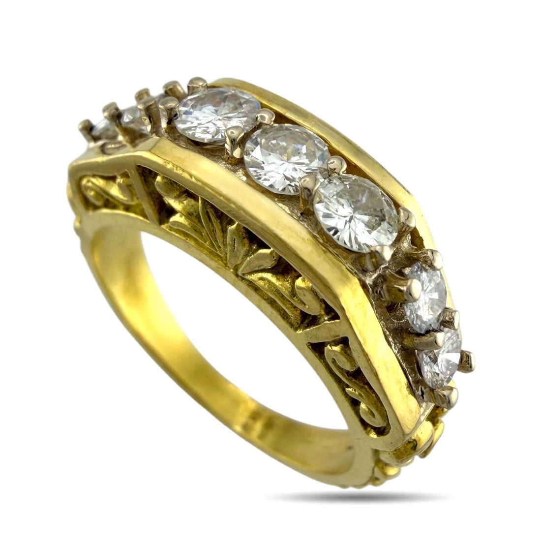 Sculpted 18K Yellow Gold and 0.75ct Diamond Ring: Sculpted 18K Yellow Gold 0.75ct Diamond Ring An elegant 18K yellow gold ring distinguished by its beautifully detailed side design and seven sparkling diamonds set along the center. The three top diam