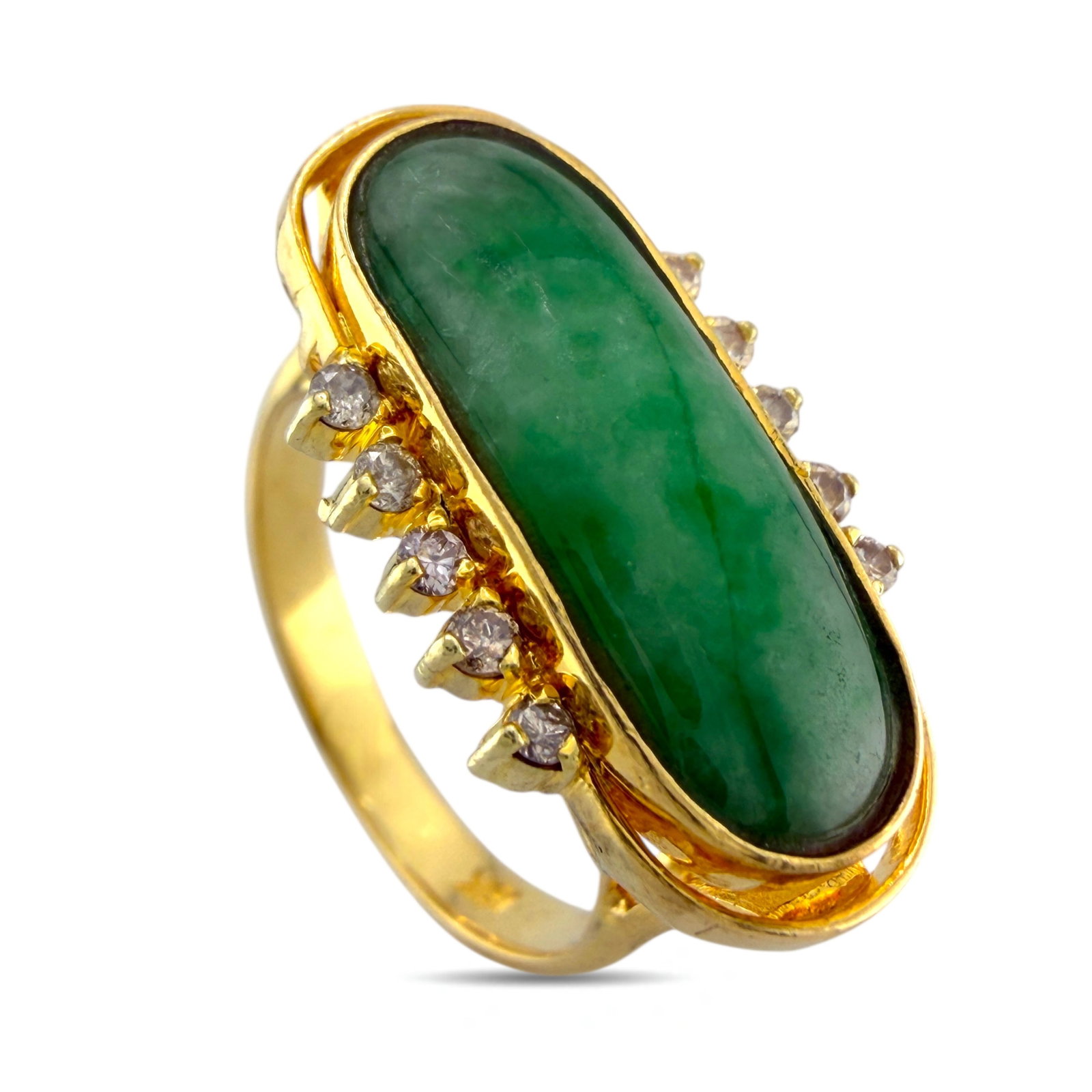 18K Yellow Gold Ring: 18K Yellow Gold Ring with Jade Stone and Diamonds This vintage inspired ring presents a graceful presence with its elongated green jade stone that draws the eye with quiet sophistication. The band has