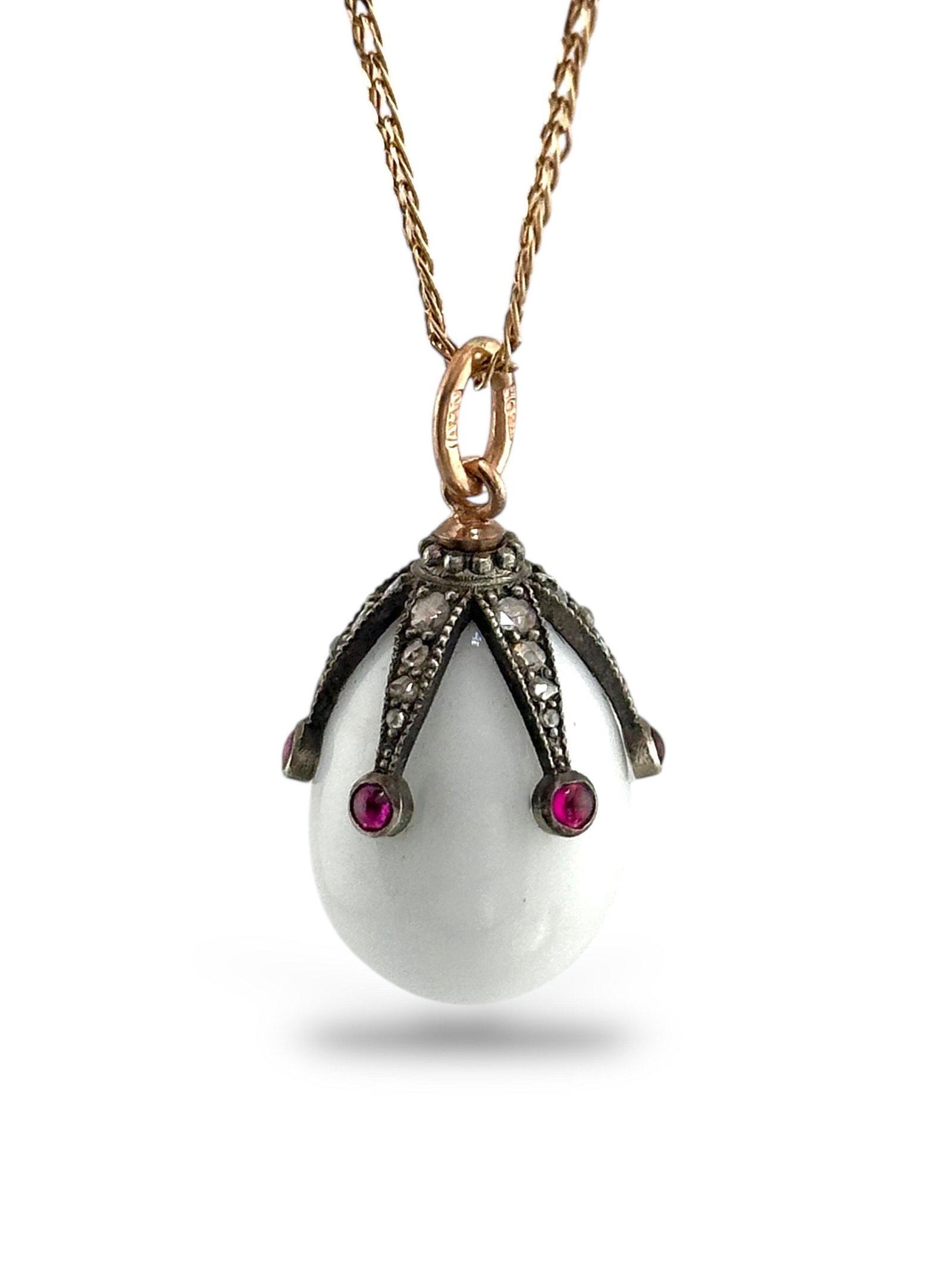 Imperial Russian Period, 56K (14K) Gold Ruby and Diamond Egg Pendant: Faberge head master August Hollming Imperial Russian 56 Gold Ruby and Diamond Pendant Egg Circa 1880-1913 Work Master: August Hollming active 1880-1913 Material: Gold 56 assay value, Enamel ( 14k Gold