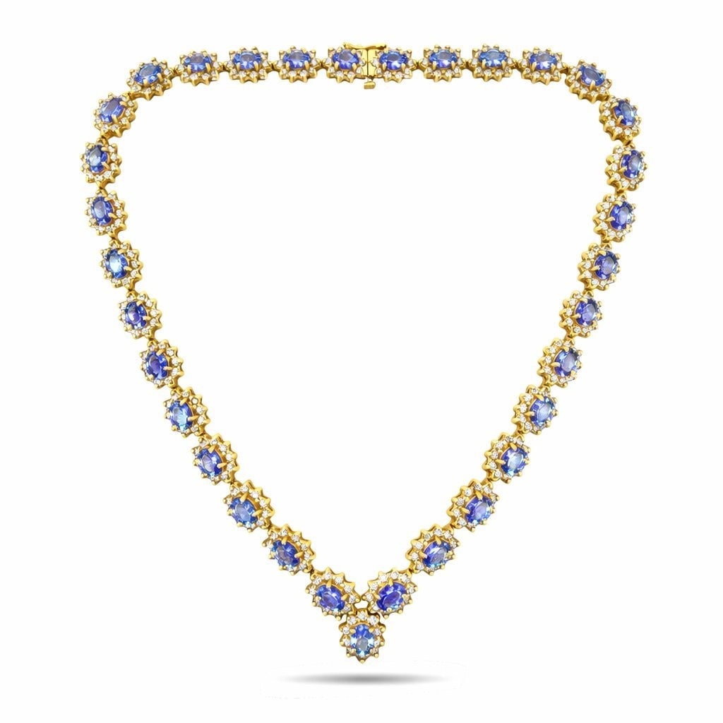 18K Yellow Gold 25ct Tanzanite and 10.5ct Diamond Necklace: 18K Yellow Gold 25ct Tanzanite and 10.5ct Diamond Necklace A beautifully made necklaces crafted in 18 karat yellow Gold, designed with oval cut tanzanites framed by diamonds throughout the entire piec