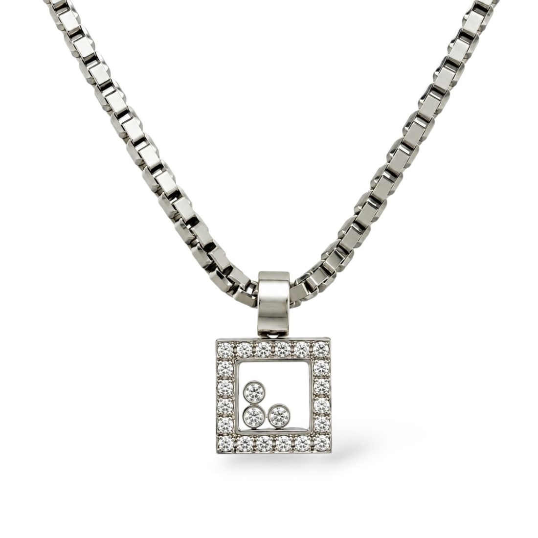 Chopard 18K White Gold 0.60ct Diamond Necklace: 18K White Gold Chopard 0.60ct Diamond Necklace A refined Chopard Happy Diamonds necklace crafted in 18 karat white gold with a distinctive box link design. The square pendant is set with diamonds acro