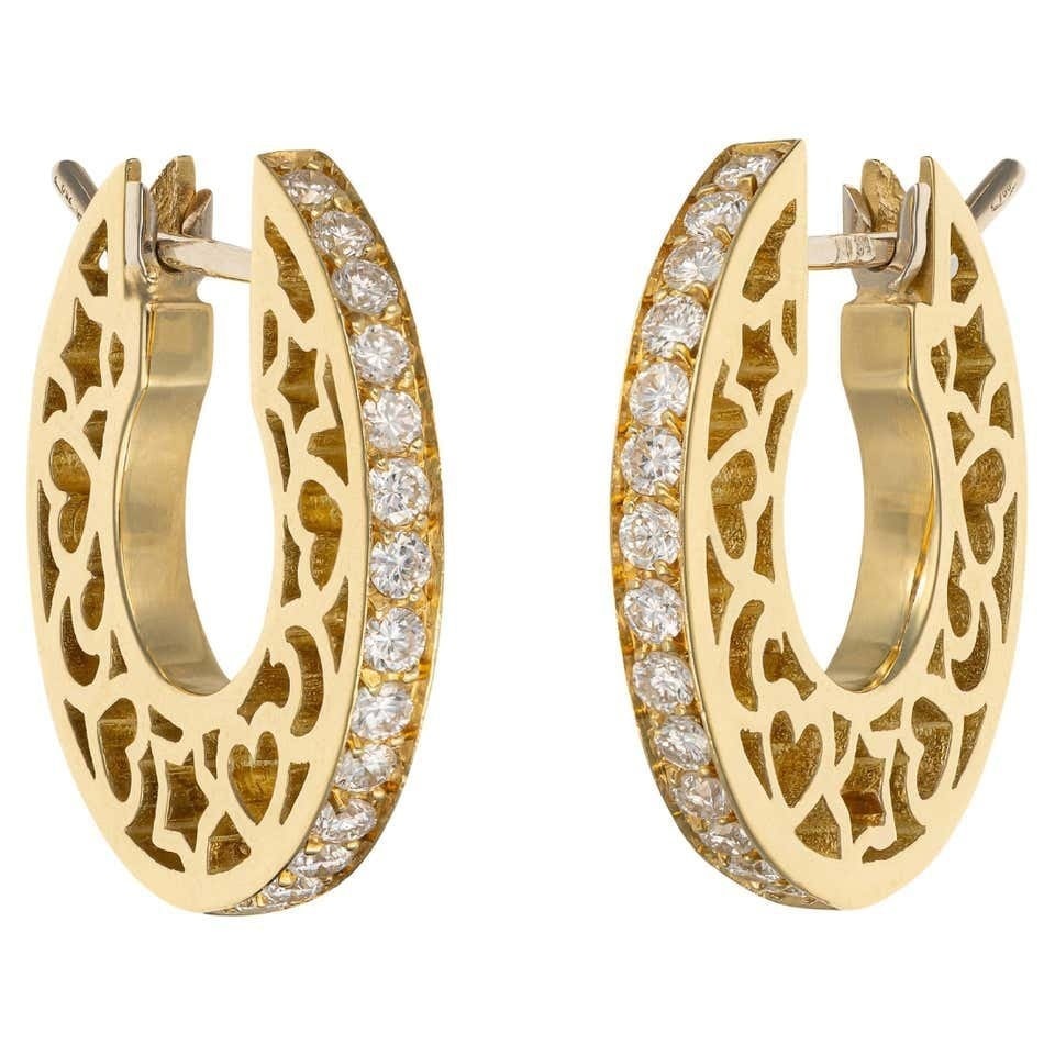 18K Yellow Gold 0.40ct Diamond Moon Design Earrings: 18K Yellow Gold 0.40ct Diamond Moon Design Earrings A distinctive pair of yellow gold earrings designed with a sculptural moon inspired form. The hollowed details feature stars, crescent moons, and he