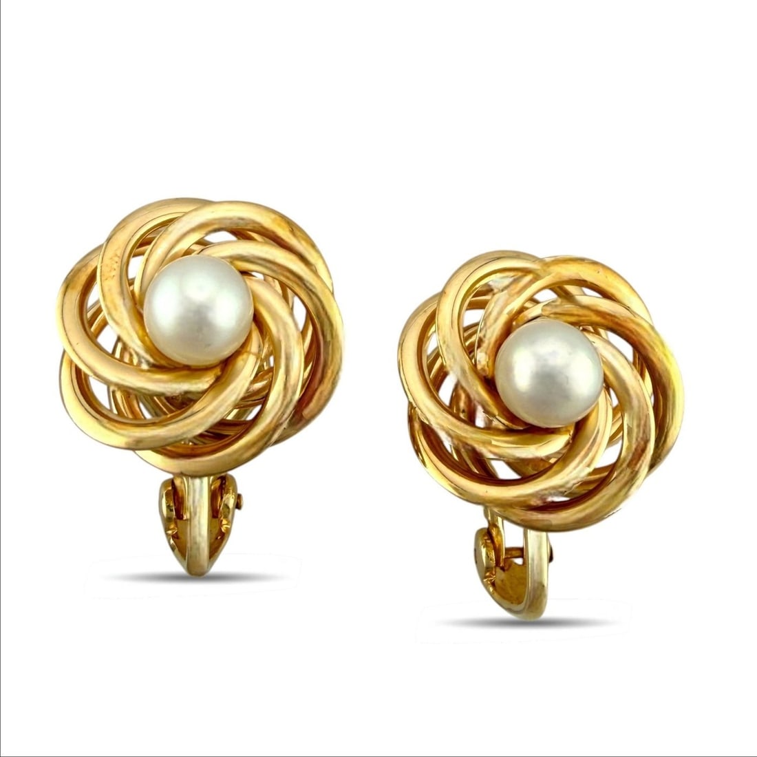 14K Yellow Gold Earrings: 14K Yellow Gold earrings A graceful pair of earrings with a classic circular design centered by luminous pearls. Crafted in rich yellow Gold, they offer an elegant and timeless look with a refined pre