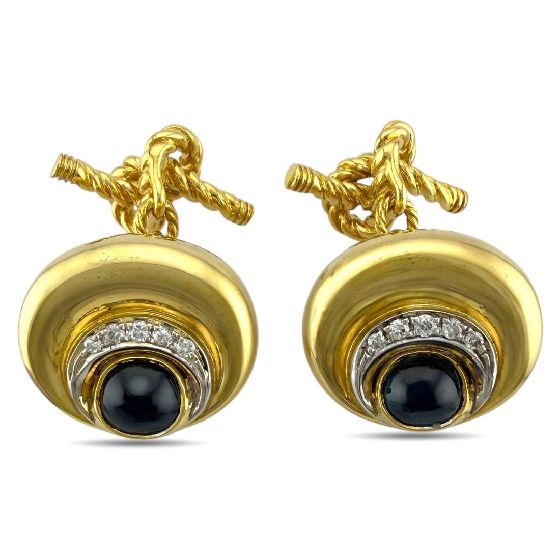 Gucci Vintage 18K Yellow Gold 2.4ct Cabochon Sapphire Cufflinks: Gucci Vintage 18K Yellow Gold 2.4ct Sapphire Cufflinks These vintage Gucci cufflinks offer an unmistakably luxurious presence with their rich yellow gold construction and classic sculptural design. A 