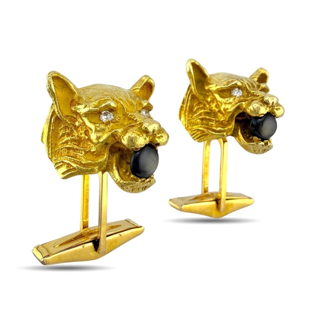 14K Yellow Gold Smoky Star Quartz and Diamond Panther Cufflinks: 14K Yellow Gold Smoky Star Quartz and Diamond Panther Cufflinks These distinctive cufflinks are crafted in 14K yellow gold and feature a sculpted panther head design at the top of each cufflink. Each 