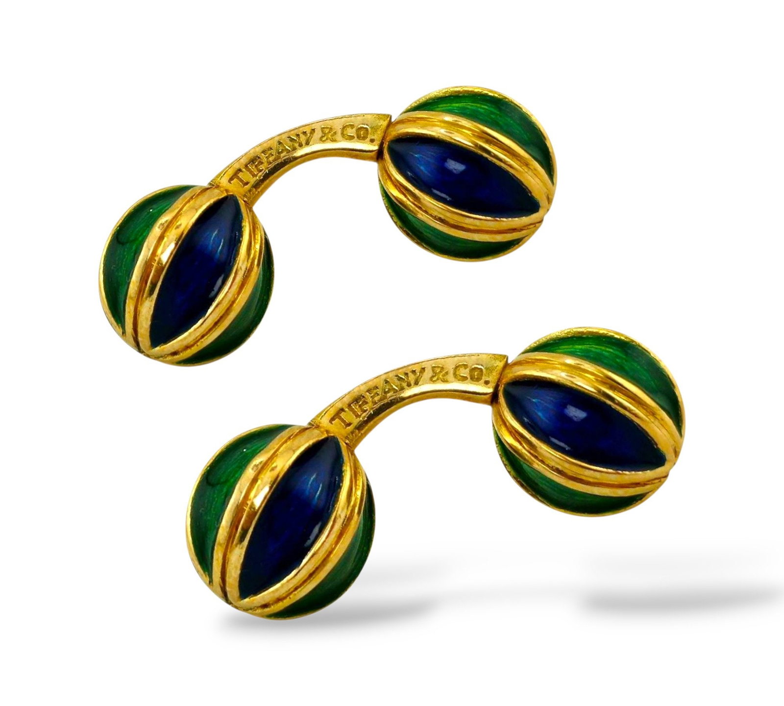 Tiffany & Co. 18K Gold and Enamel Cufflinks: Rare Pair of Tiffany & Co. 18K Yellow Gold and Enamel Knot Cufflinks A distinctive pair of figural cufflinks from Tiffany & Co., expertly crafted in rich 18K yellow gold. These rare "knot" design
