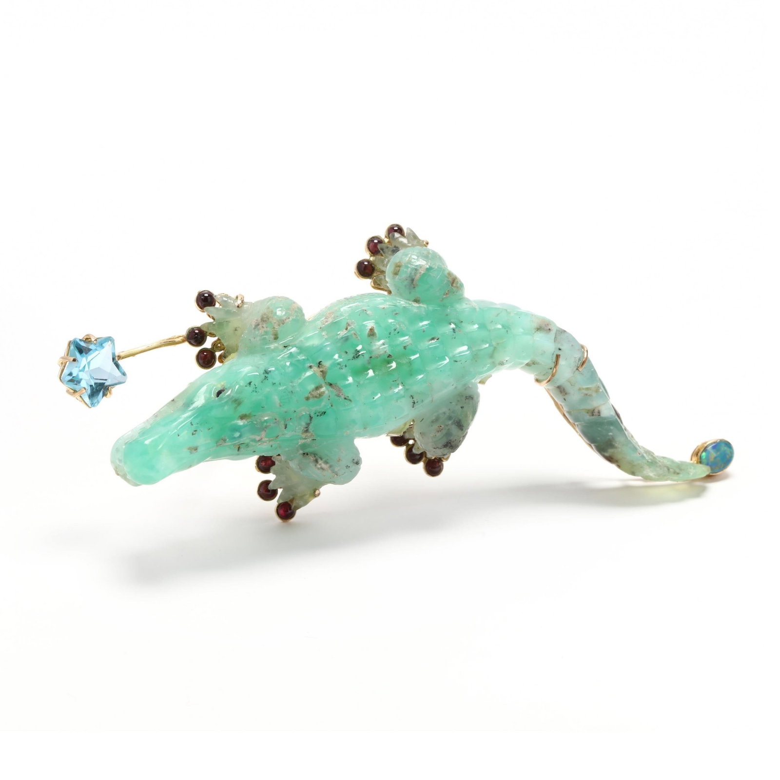 14K Yellow Gold and Jade Crocodile Brooch: This striking alligator design features rich green jade intricately carved and set in 14K yellow gold, exuding elegance and craftsmanship. Its feet are adorned with vibrant rubies, while shimmering li