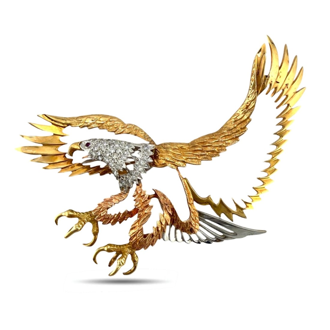 14K Tri-Color Gold 1.0ct Diamond Eagle Silhouette Large Brooch: 14K Tri-Color Gold 1.0ct Diamond Eagle Silhouette Large Brooch A bold and sculptural eagle brooch rendered in a hollow silhouette, combining rose, yellow, and white gold for striking contrast. The exp