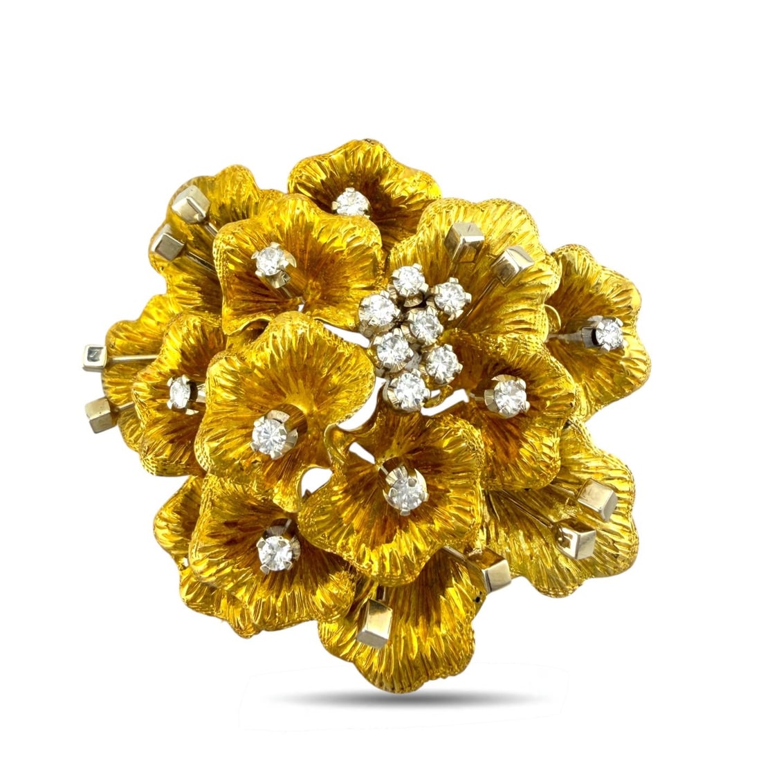 18K Yellow Gold 1.00ct Diamond Flower Brooch: 18K Yellow Gold 1.00ct Diamond Flower Brooch A refined floral brooch crafted in rich yellow gold, designed with layered petals and a radiant cluster of diamonds emerging from the center. The compositi