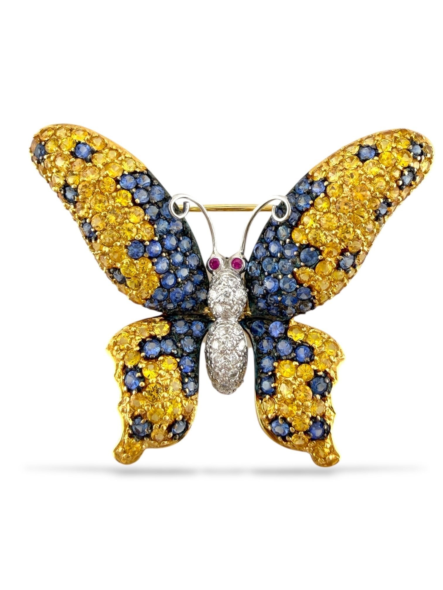 18K Yellow Gold Multi-Color Sapphire, Diamond, and Ruby Butterfly Brooch: 18K Yellow Gold Multi-Color Sapphire, Diamond, and Ruby Butterfly Brooch A breathtaking display of color and craftsmanship, this exquisite butterfly brooch is brought to life in 18K yellow gold, adorn