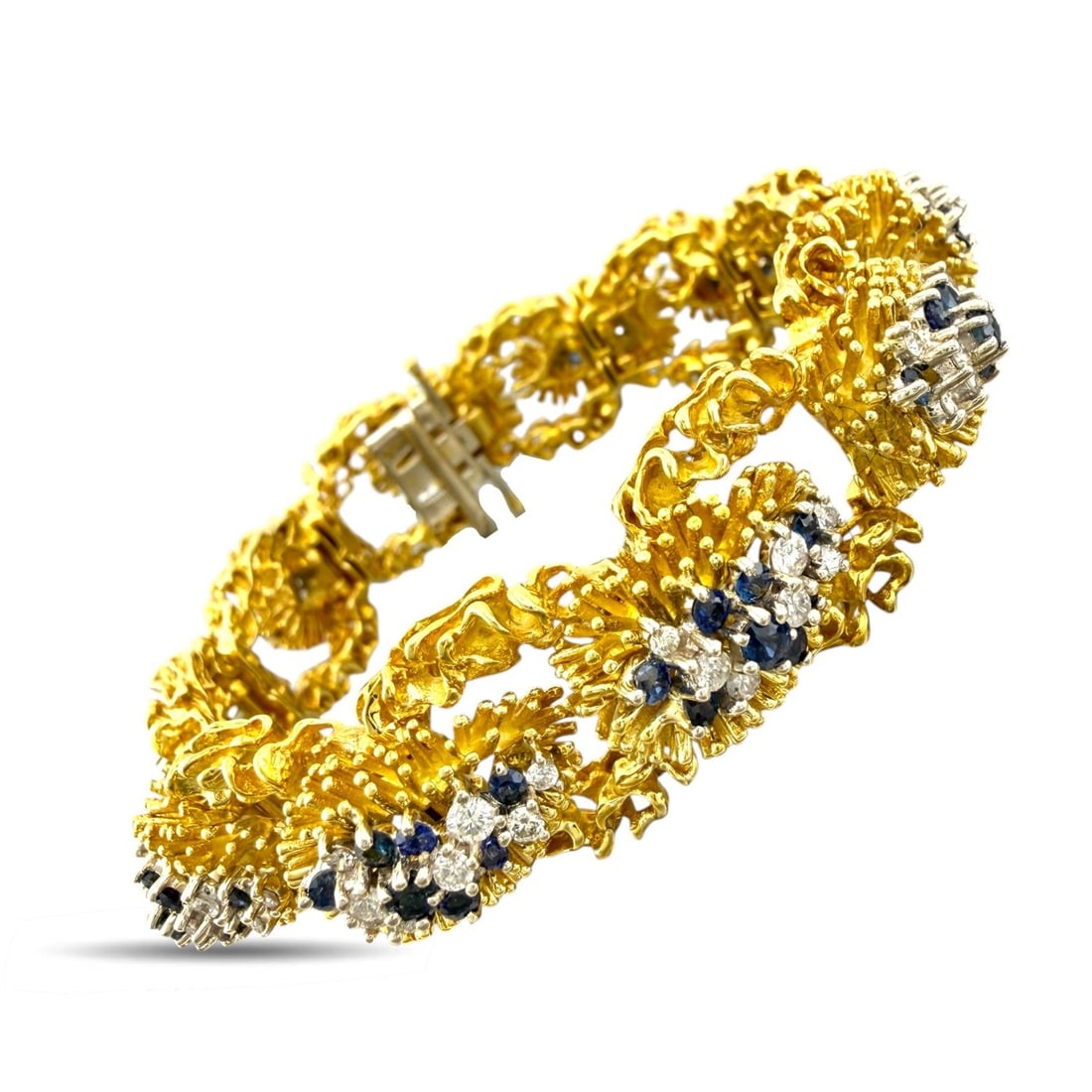 18K Yellow Gold Woven Textured 4.5ct Diamond and 3ct Sapphire Bracelet: 18K Yellow Gold Woven Textured 4.5ct Diamond and 3ct Sapphire Bracelet A bold and substantial bracelets crafted in 18 karat yellow Gold, designed with a richly woven textured finish that gives the pie