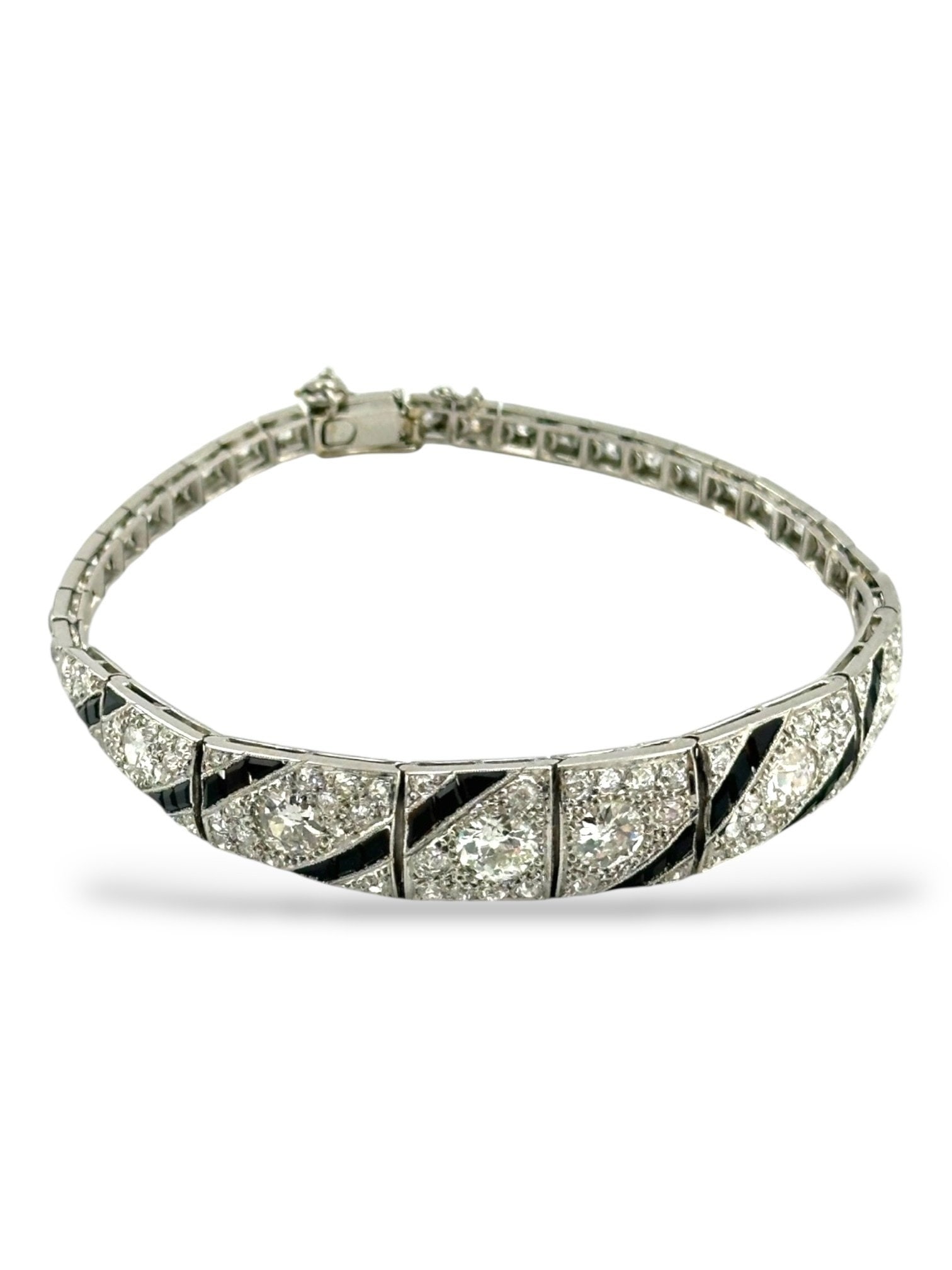 18K White Gold Art Deco 6ct Diamond Bracelet: 18K Gold Art Deco 6.0ctw. Diamond Bracelet A dazzling display of brilliance and contrast, this exquisite bracelet features 103 carefully set diamonds totaling 6.0 carats. The luminous white diamonds a