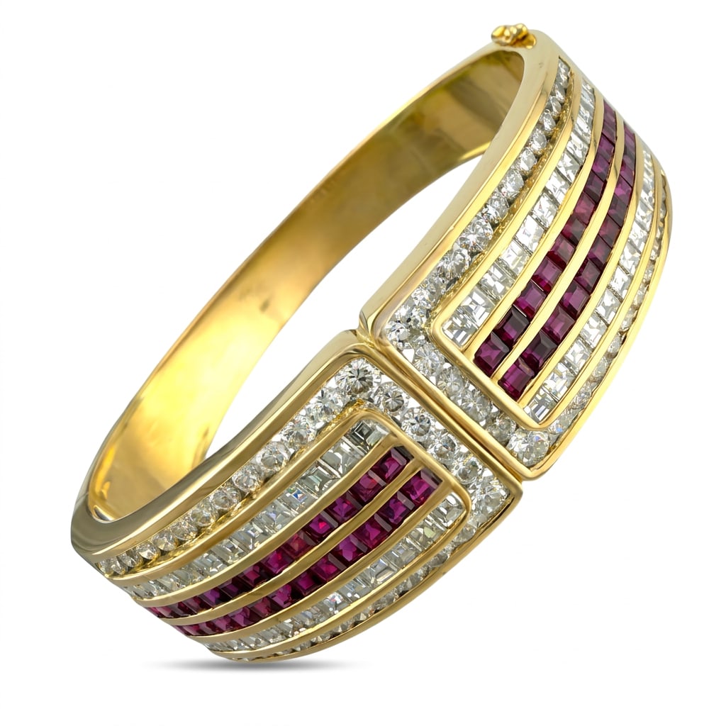 18K Yellow Gold 5.2ct Ruby and 7.02ct Diamond Hinged Bracelet: 18K Yellow Gold 5.2ct Ruby and 7.02ct Diamond Hinged Bracelet This stunning bracelet features a sophisticated and symmetrical design set in 18K yellow gold. The hinged band opens to reveal two matchin