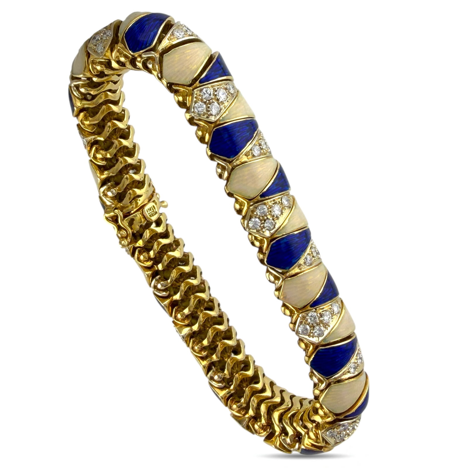 Italian 18K Yellow Gold 2.7ct Diamond, Blue and Tan Enameled Bracelet: Italian 18K Yellow Gold 2.7ct Diamond, Blue and Tan Enameled Bracelet This covered bracelet pairs lively blue and tan enamel with a warm yellow gold frame for a refined, decorative effect. The flexibl