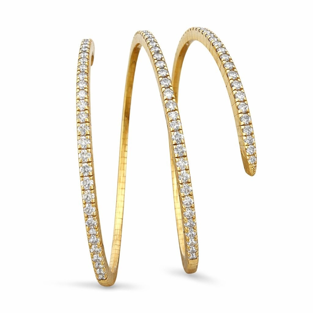 14K Yellow Gold 5.6ct Diamond Flexible Arm Bracelet: 14K Yellow Gold 5.6ct Diamond Flexible Arm Bracelet A bold and sculptural piece designed to elegantly wrap around the arm, this flexible bracelet features a dynamic twisting silhouette that creates mo