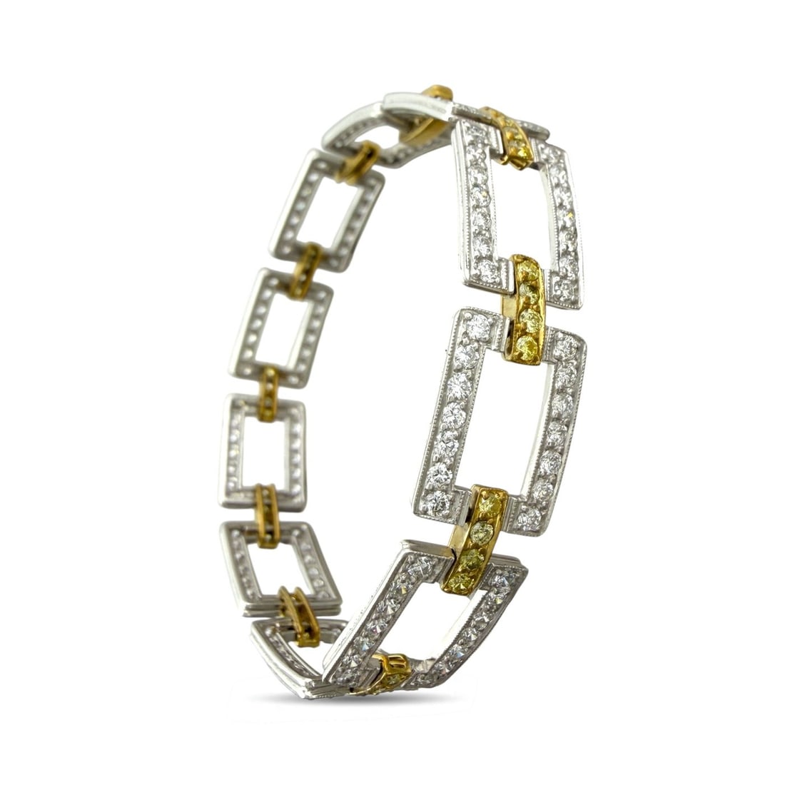 18K Yellow Gold and Platinum 5.54ct Diamond and 1.08ct Yellow Sapphire Link Bracelet: 18K Yellow Gold and Platinum 5.54 Diamond and Yellow 1.08 Sapphire Link Bracelet A refined interplay of tone and geometry defines this articulated bracelet, where luminous platinum square links are me