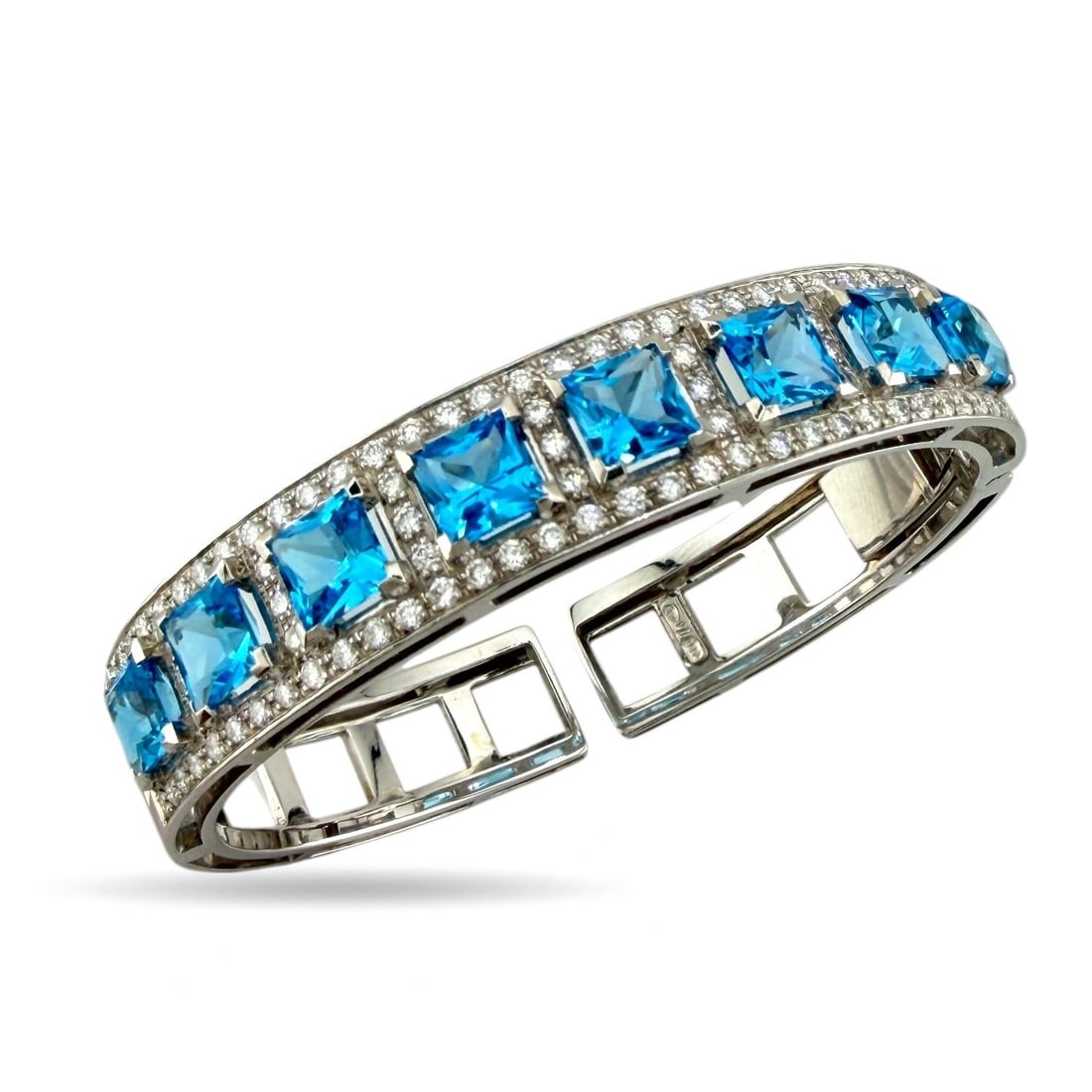 18K White Gold 2.8ct Diamond and Blue Topaz Bracelet: Vintage 18K White Gold 2.8ct Diamond and Blue Topaz Bracelet This stunning vintage bracelet showcases a refined balance of brilliance and color. Crafted in marked 18K yellow gold, it features 93