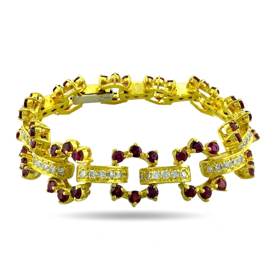 18K Yellow Gold 2ct Diamond and Ruby Bracelet: 18K Yellow Gold 2ct Diamond and Ruby Bracelet A striking balance of color and brilliance defines this elegant 18K yellow gold bracelet, adorned with 66 radiant diamonds totaling approximately 2.0