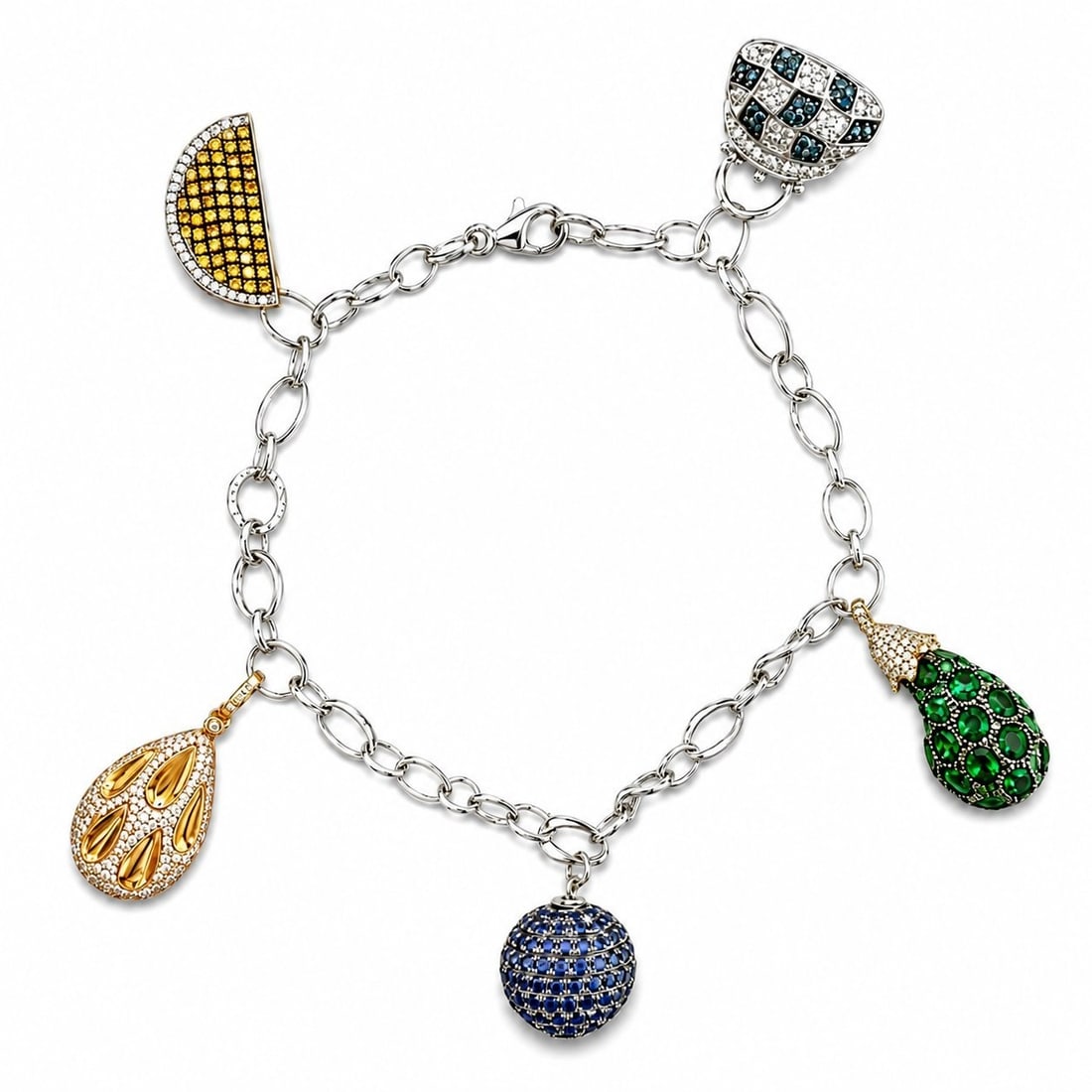 18K Three Tone Gold Diamond Sapphire and Emerald Ornament Bracelet: 18K Three-Tone Gold Diamond, Sapphire, and Emerald Ornament Bracelet 18K white, yellow, and rose gold bracelet designed with multiple decorative ornament elements throughout. The ornaments are