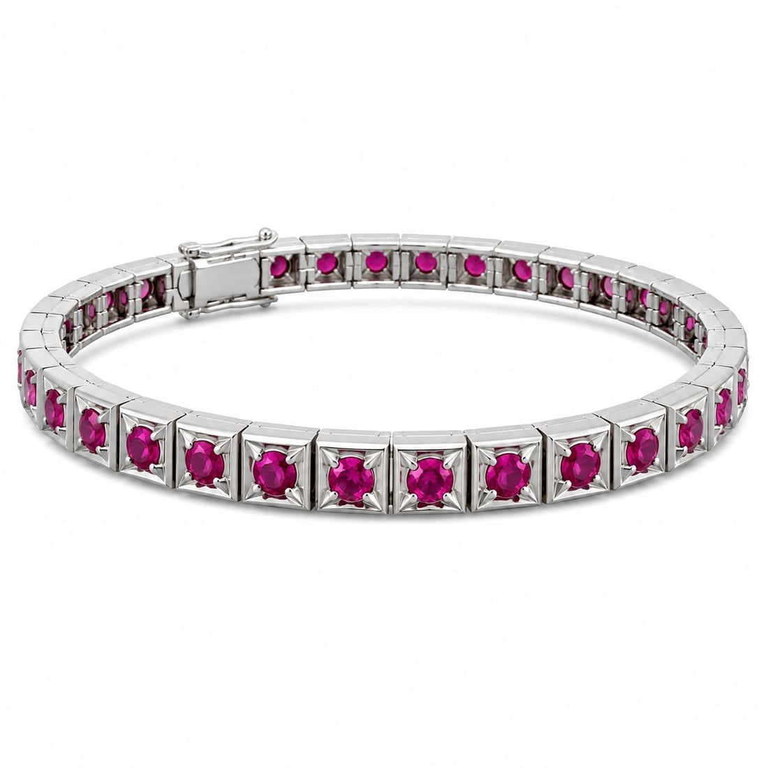 Ruby Tennis Bracelet: Platinum Ruby Tennis Bracelet This refined tennis bracelet is crafted in platinum and set with a continuous row of rubies throughout the design. The substantial platinum weight and classic tennis