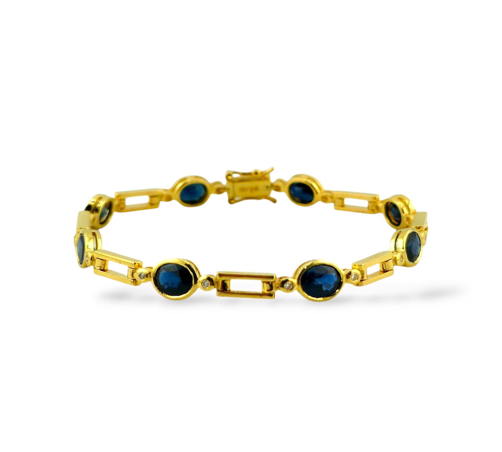 18K Yellow Gold Bracelet: 18K Yellow Gold Bracelet with Oval Sapphires and Round Diamonds Expertly crafted in radiant 18K yellow gold, this vintage bracelet features eight captivating oval-cut sapphires, each measuring 6.5mm