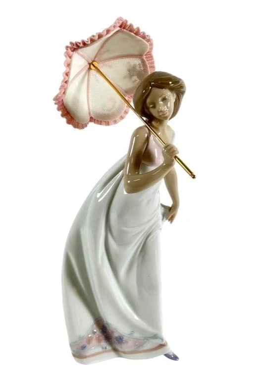 Lladro Afternoon Promenade 7636 Porcelain Figurine: Lladro Vintage Limited Edition Afternoon Promenade 7636Lladro porcelain figurine titled Afternoon Promenade, model #7636. The piece depicts a woman in a flowing white gown holding a pink and gold para