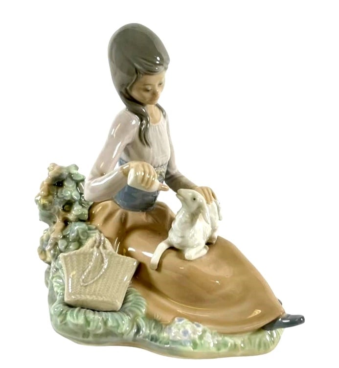 LLADRO LITTLE BO PEEP 1974-85 PORCELAIN FIGURINE 1312G: LLADRO LITTLE BO PEEP 1974-85 PORCELAIN FIGURINE 1312GLladró porcelain figurine titled Little Bo Peep, model #1312. Depicts a seated girl with bonnet and lamb, surrounded by delicate floral accents. 
