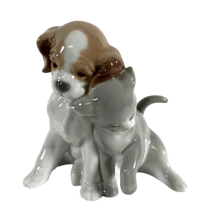 Lladro Porcelain Against All Odds 8301: Lladro Limited Edition Porcelain Against All Odds 8301Porcelain figurine by Lladro titled 'Against All Odds,' model number 8301. Depicts a puppy and kitten seated together in a lifelike pose. Glazed f