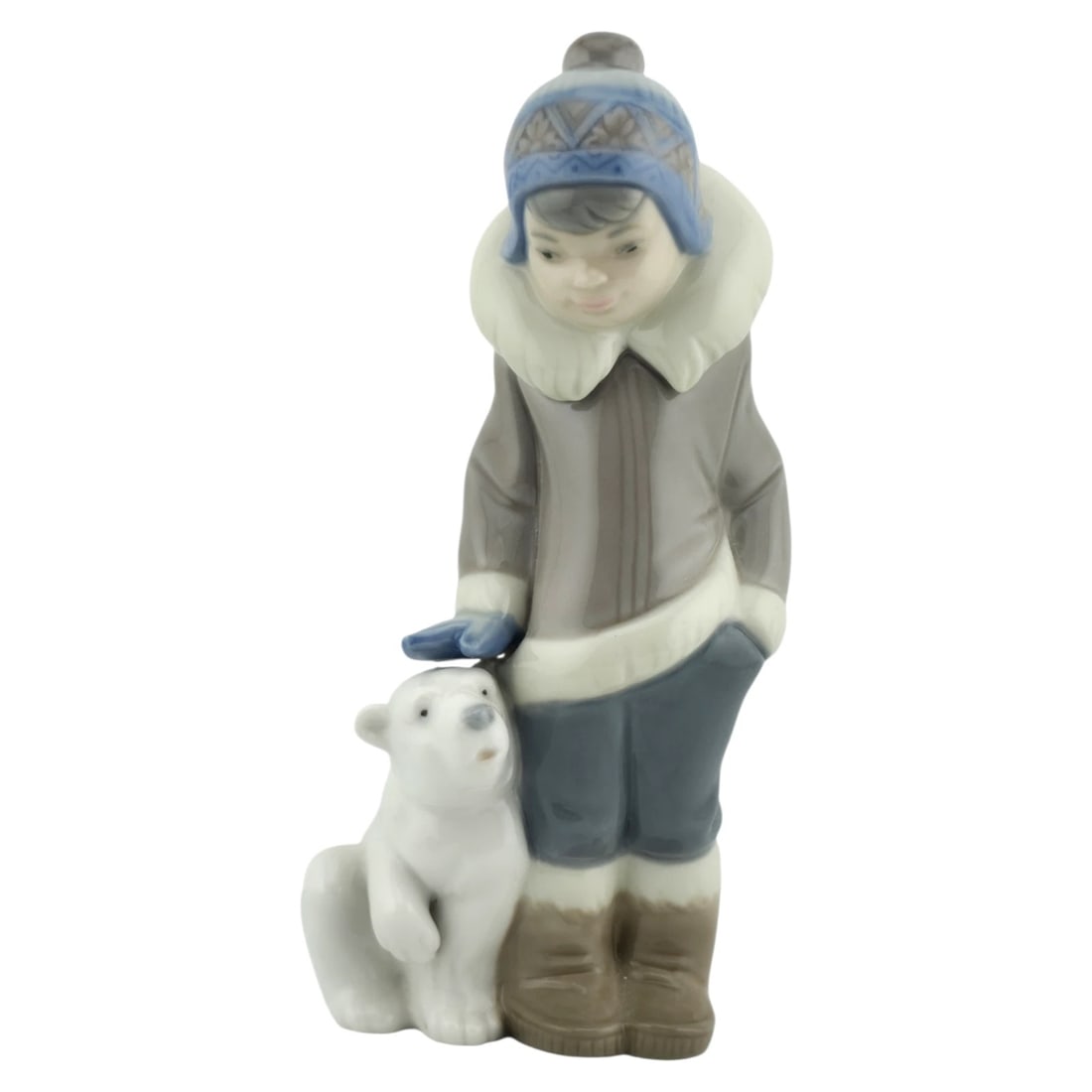 LLADRO Retired Eskimo Boy with Polar Bear Cub 5238 Hand Painted Porcelain: LLADRO Retired Eskimo Boy with Polar Bear Cub 5238 Hand Painted Porcelain3.25L x 2.5W x 6H The Lladro Porcelain 1984 Eskimo Boy and Polar Bear sculpture is a remarkable piece that beautifully captures