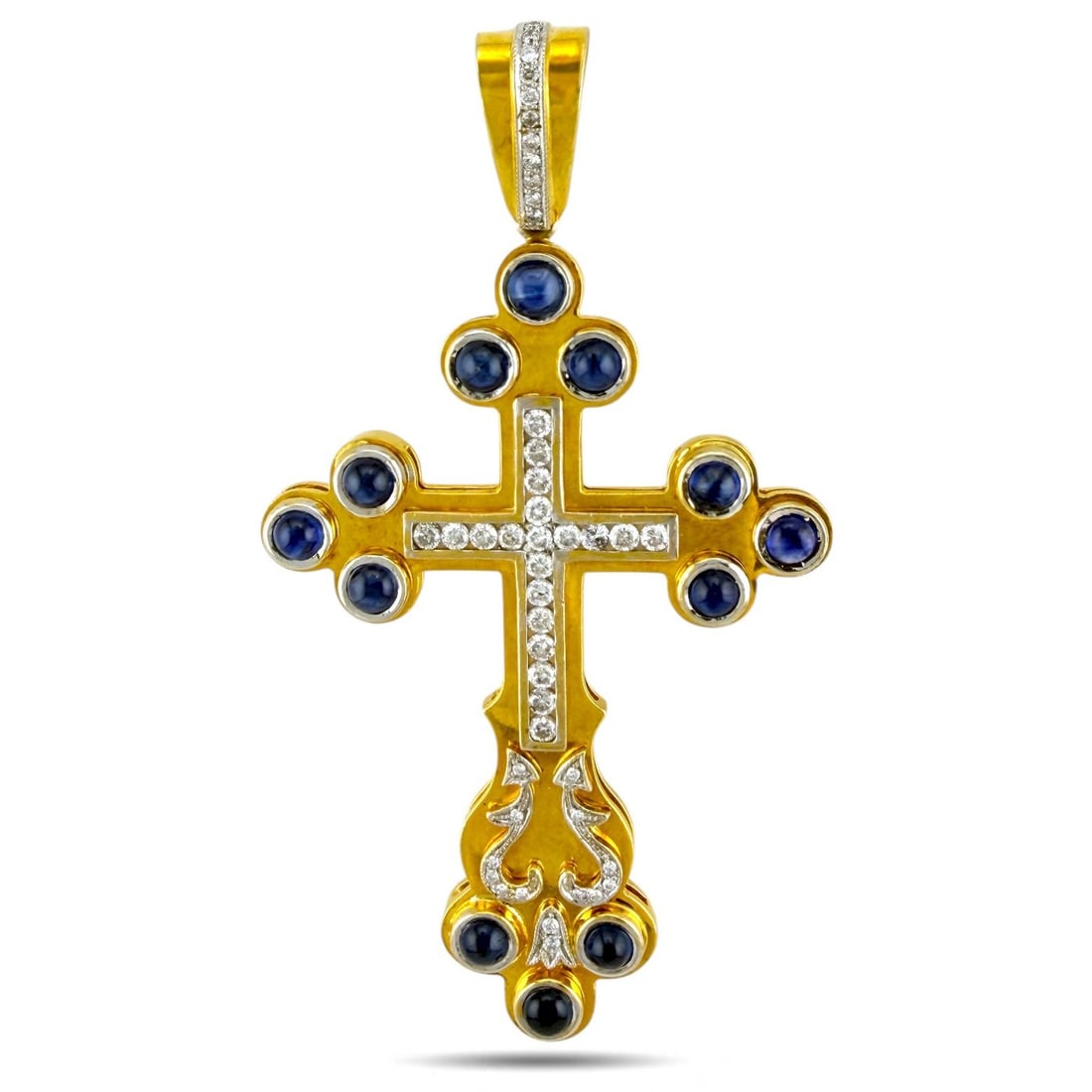 18K Yellow Gold 1.50ct Diamond & 2.50ct Sapphire Cross Pendant: 18K Yellow Gold 1.50ct Diamond & 2.50ct Sapphire Cross Pendant A striking and substantial cross pendant crafted in radiant 18K yellow gold, designed with both brilliance and depth. At its heart lies a