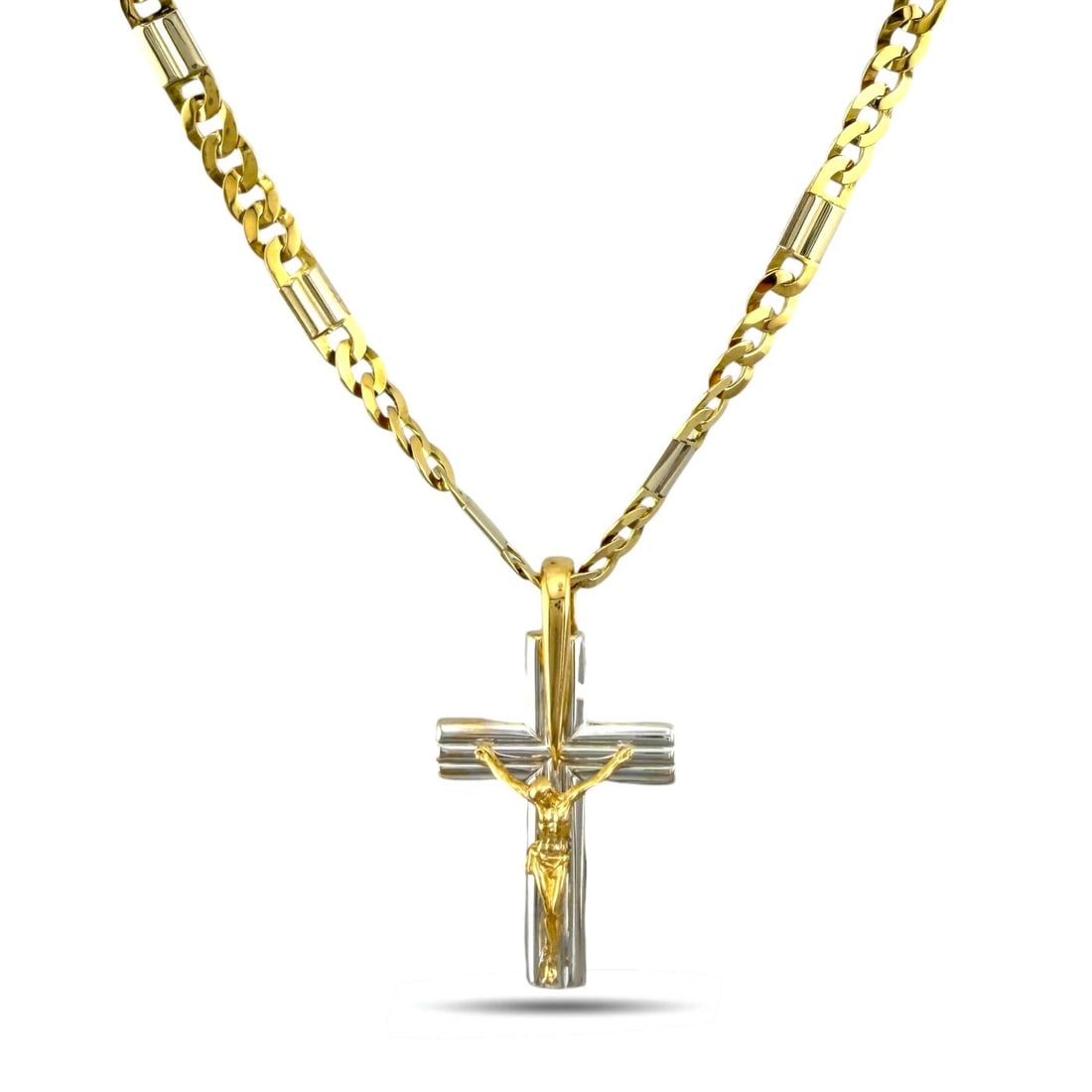 Marzi 18K Yellow and White Gold Crucifix Pendant: Marzi 18K Yellow and White Gold Crucifix Pendant Necklace A beautifully made pendant necklace by Marzi, crafted in 18 karat yellow and white gold. The piece features a richly detailed crucifix with