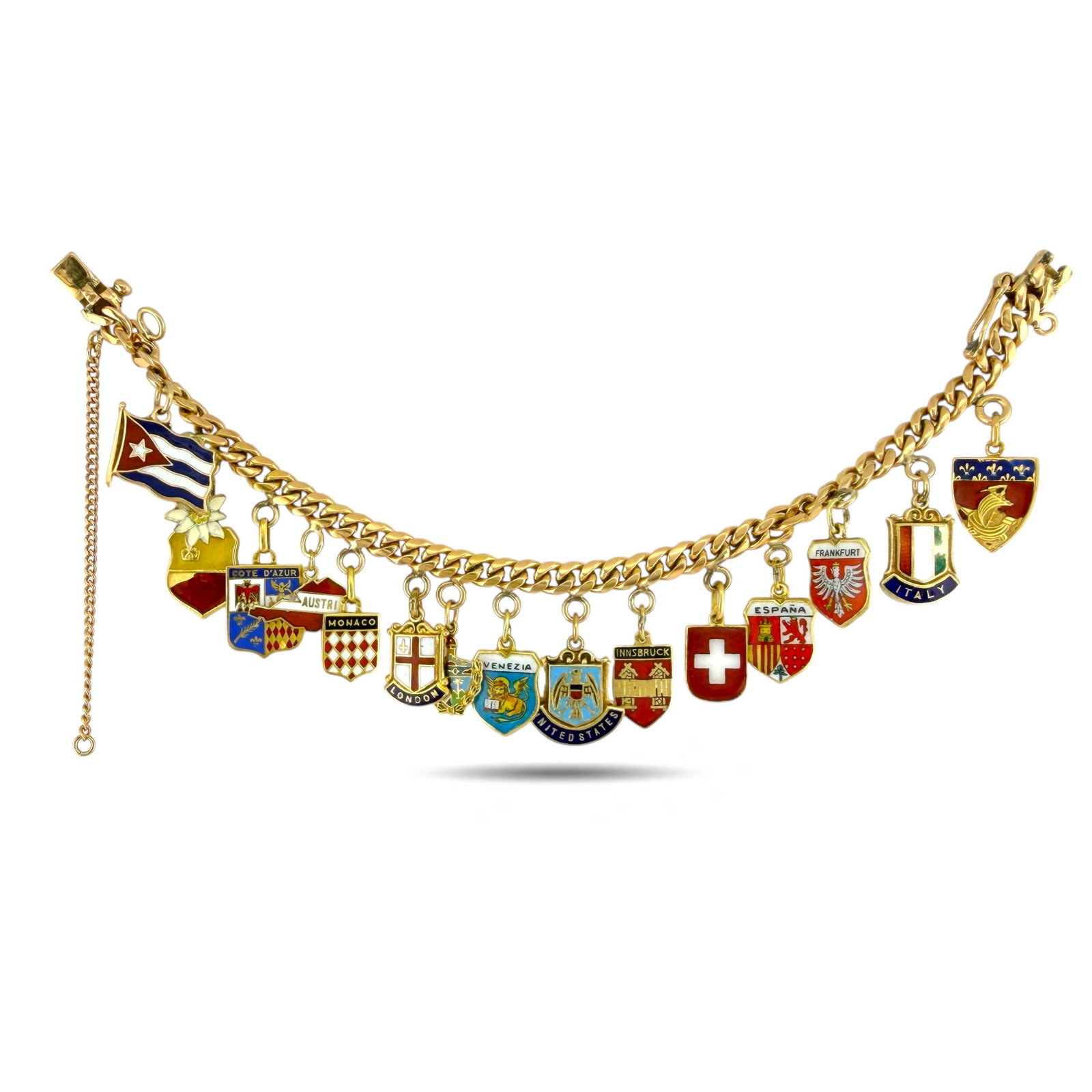 European and American Gold Travel Shield Charm: European and American Gold Travel Shield Bracelet, 18K Charm Bracelet A substantial and beautifully crafted vintage travel shield bracelet, featuring a collection of gold shields from various European