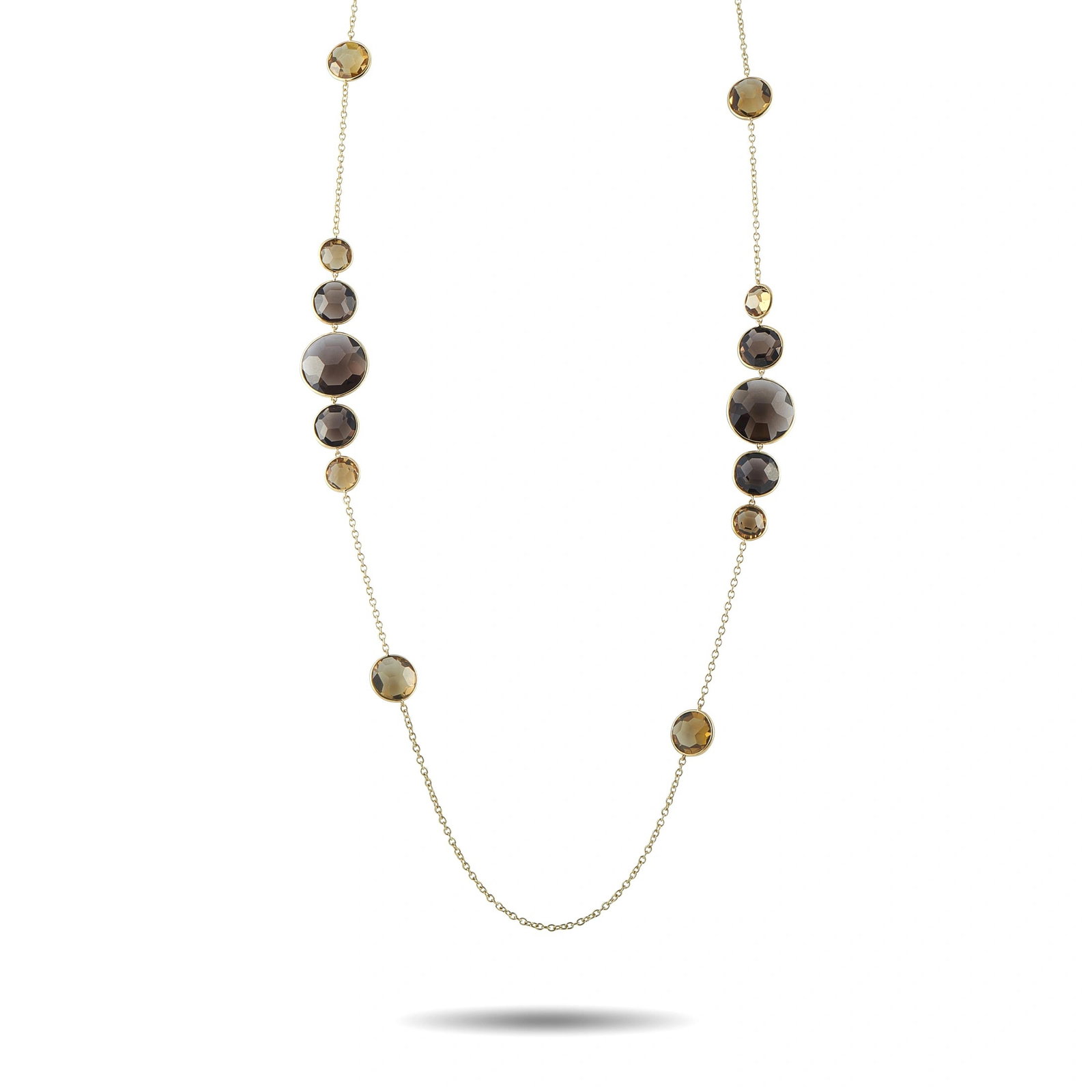 Ippolita 18K Yellow Gold Smoky Quartz Necklace: Smoky Quartz gemstones in a range of colors add dimension to this exquisite Ippolita necklace. Simple and elegant, the 35” chain makes it a dramatic addition to any ensemble. It’s crafted from