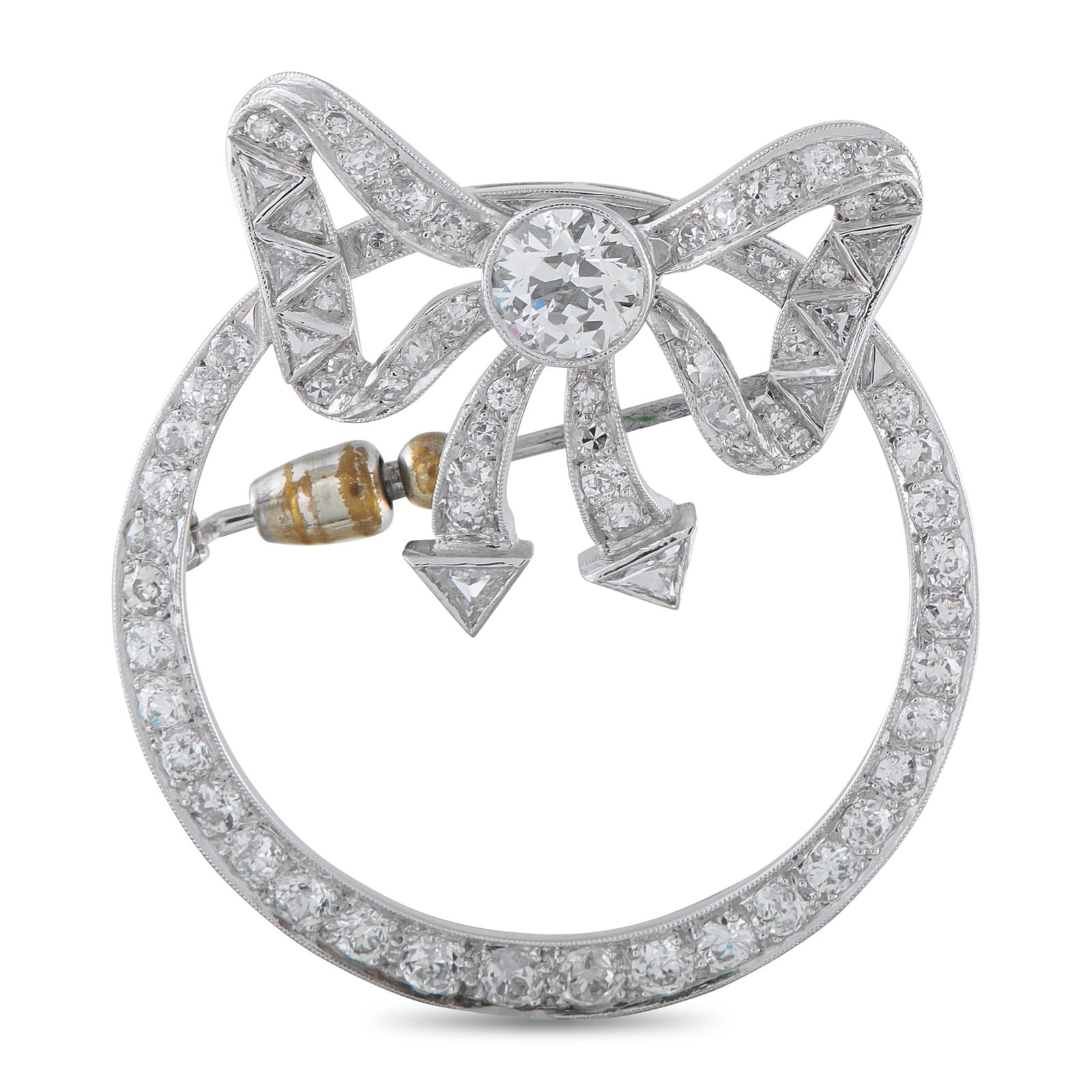 Platinum and 14K White Gold 4.10ct Diamond Wreath Brooch: Crafted in platinum and 14k white gold, this brooch takes the form of a wreath. The circular outline is traced with round diamonds that gradually reduce in size as they ascend, creating a gentletaper