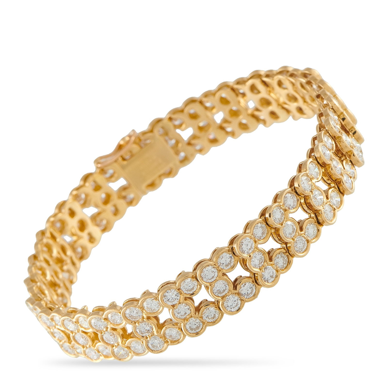 Van Cleef & Arpels Vintage 18K Yellow Gold 10.50ct Diamond Bracelet: This vintage Van Cleef & Arpels bracelet is a luxury piece with obvious elegance. Bezel set Diamonds totaling 10.50 carats shine brightly from their place within the sophisticated 18K Yellow Gold meta